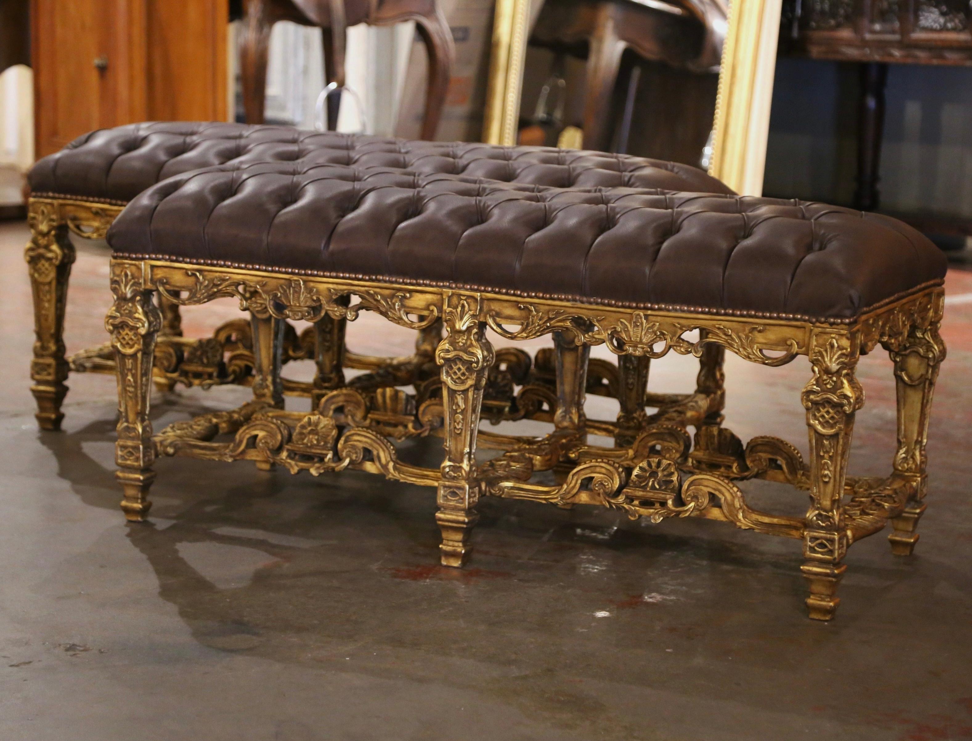 Decorate a den, living room or hallway with this elegant pair of antique benches. Crafted in France circa 1960 and rectangular in shape, each elegant seat stands on six ornately carved legs decorated with acanthus designs. The benches are further
