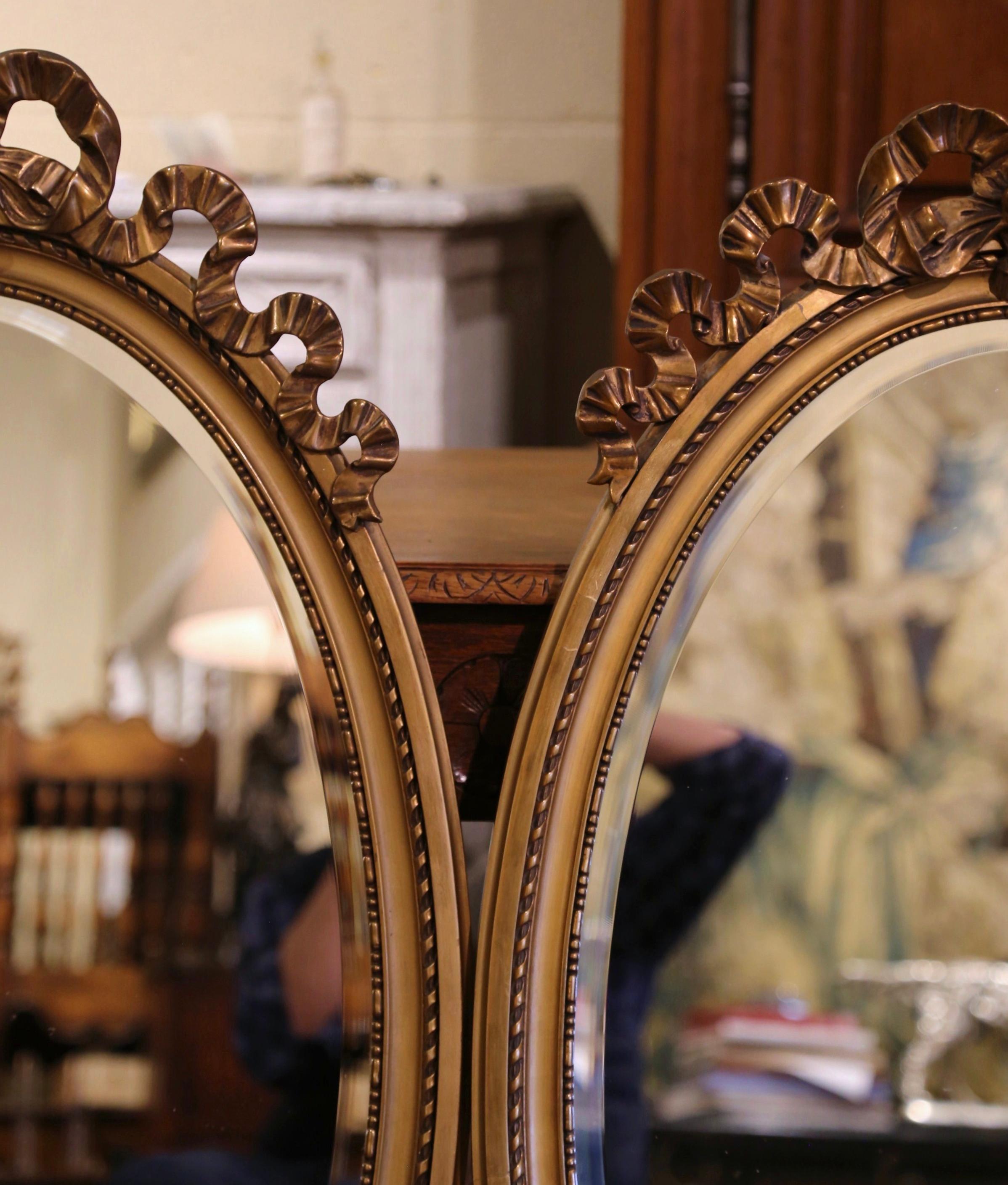 20th Century Pair of Mid-Century French Louis XVI Carved Giltwood Beveled Oval Wall Mirrors