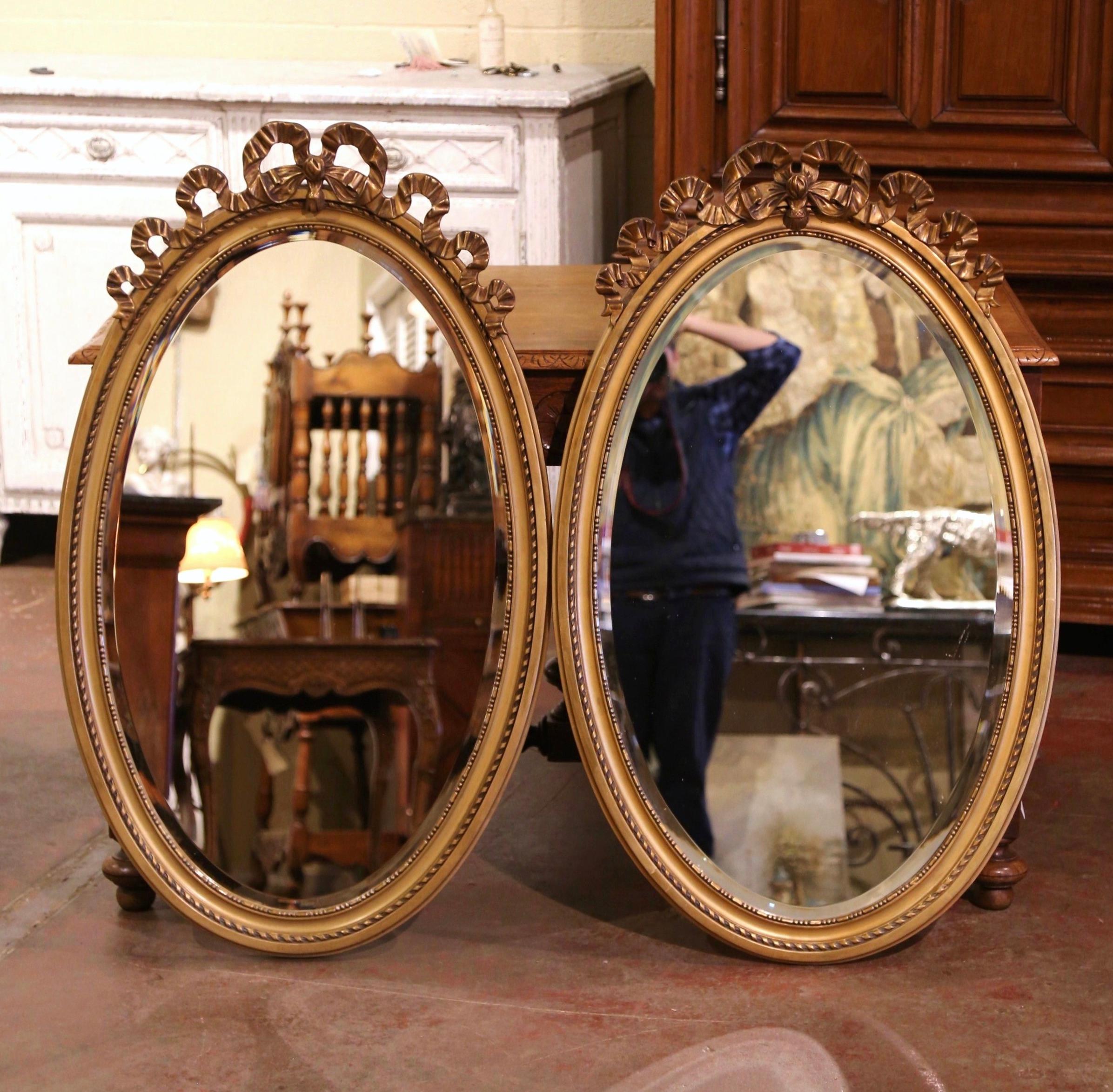 Glass Pair of Mid-Century French Louis XVI Carved Giltwood Beveled Oval Wall Mirrors
