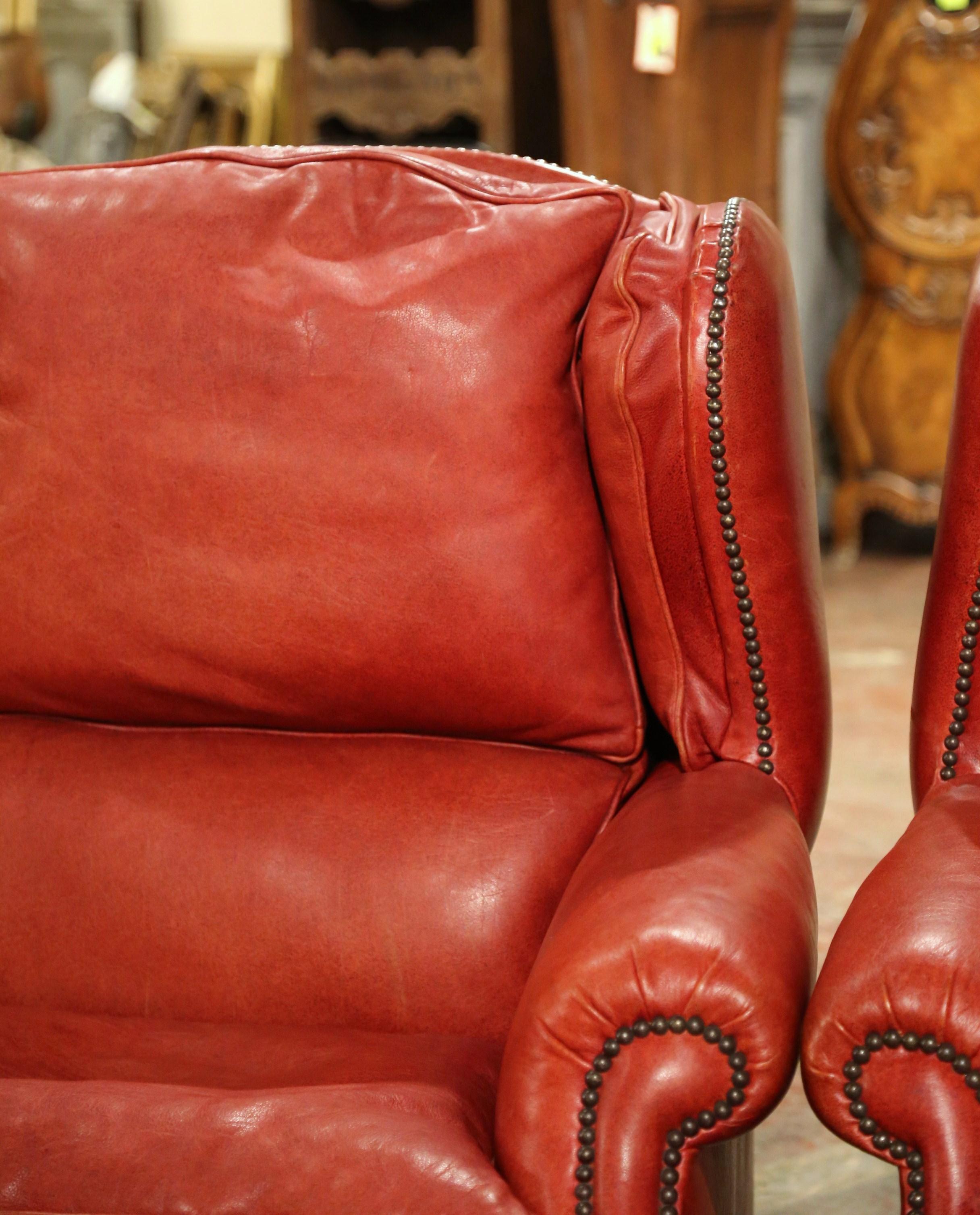 20th Century Pair of Mid-Century French Red Leather Wing Back Club Armchairs with Nail Heads For Sale