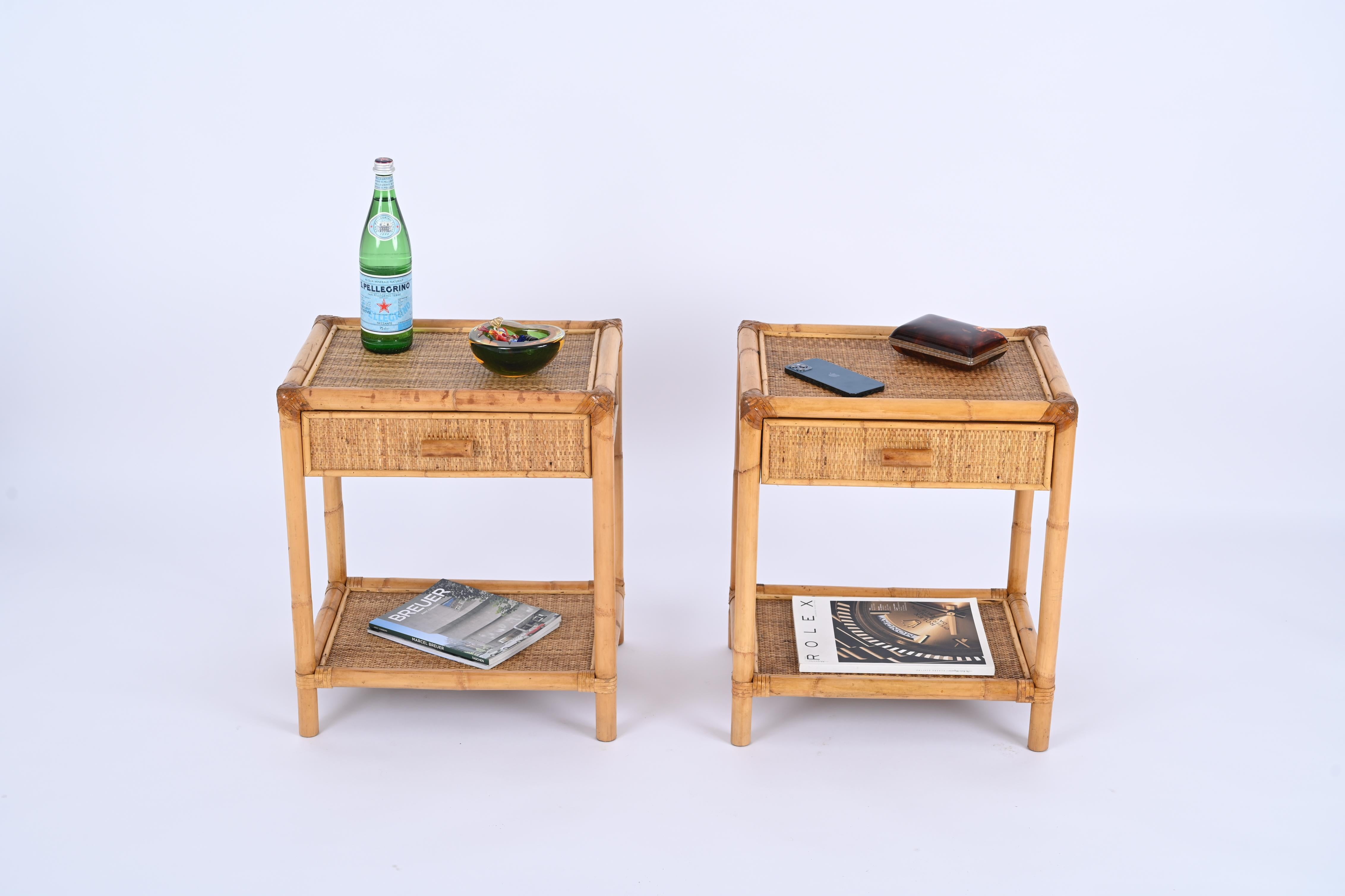 Lovely pair of Mid-Century nightstands in bamboo and woven rattan. These  beautiful pieces were designed in Italy during the 1970s.

These bedside tables are fully made in bamboo canes and enriched all around by stunning woven rattan.  The corners