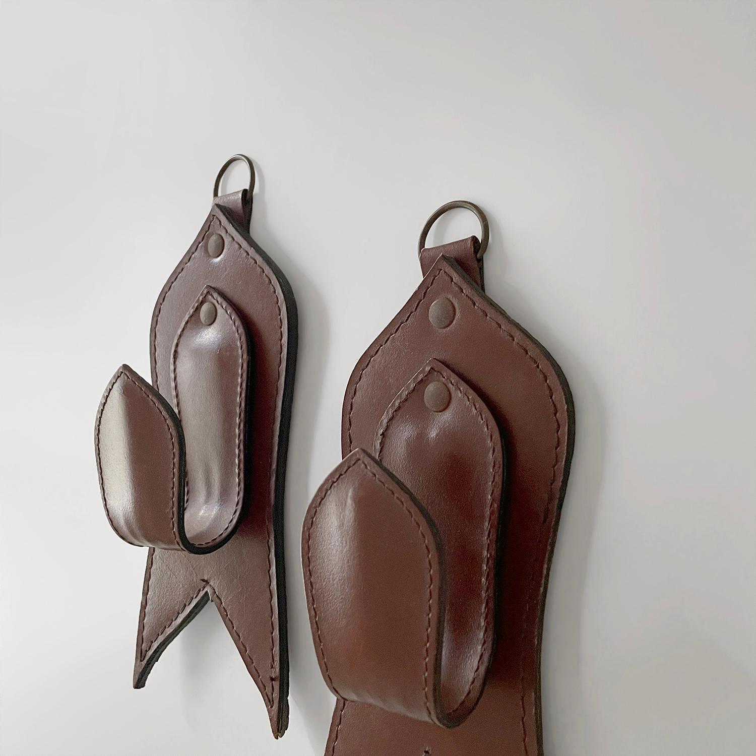 Pair of Mid Century French Saddle Leather Wall Coat Hooks in the style of Adnet In Good Condition For Sale In Los Angeles, CA