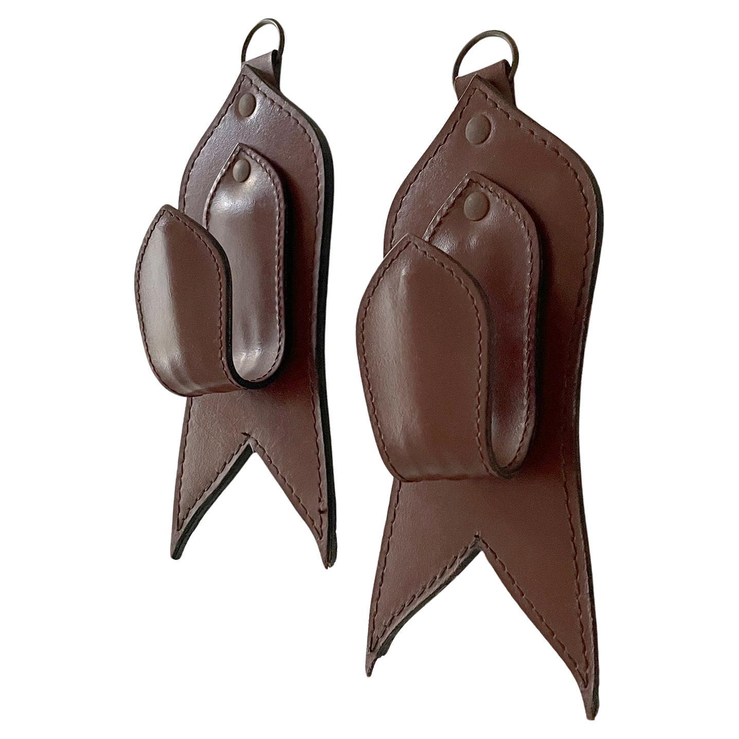 Pair of Mid Century French Saddle Leather Wall Coat Hooks in the style of Adnet For Sale