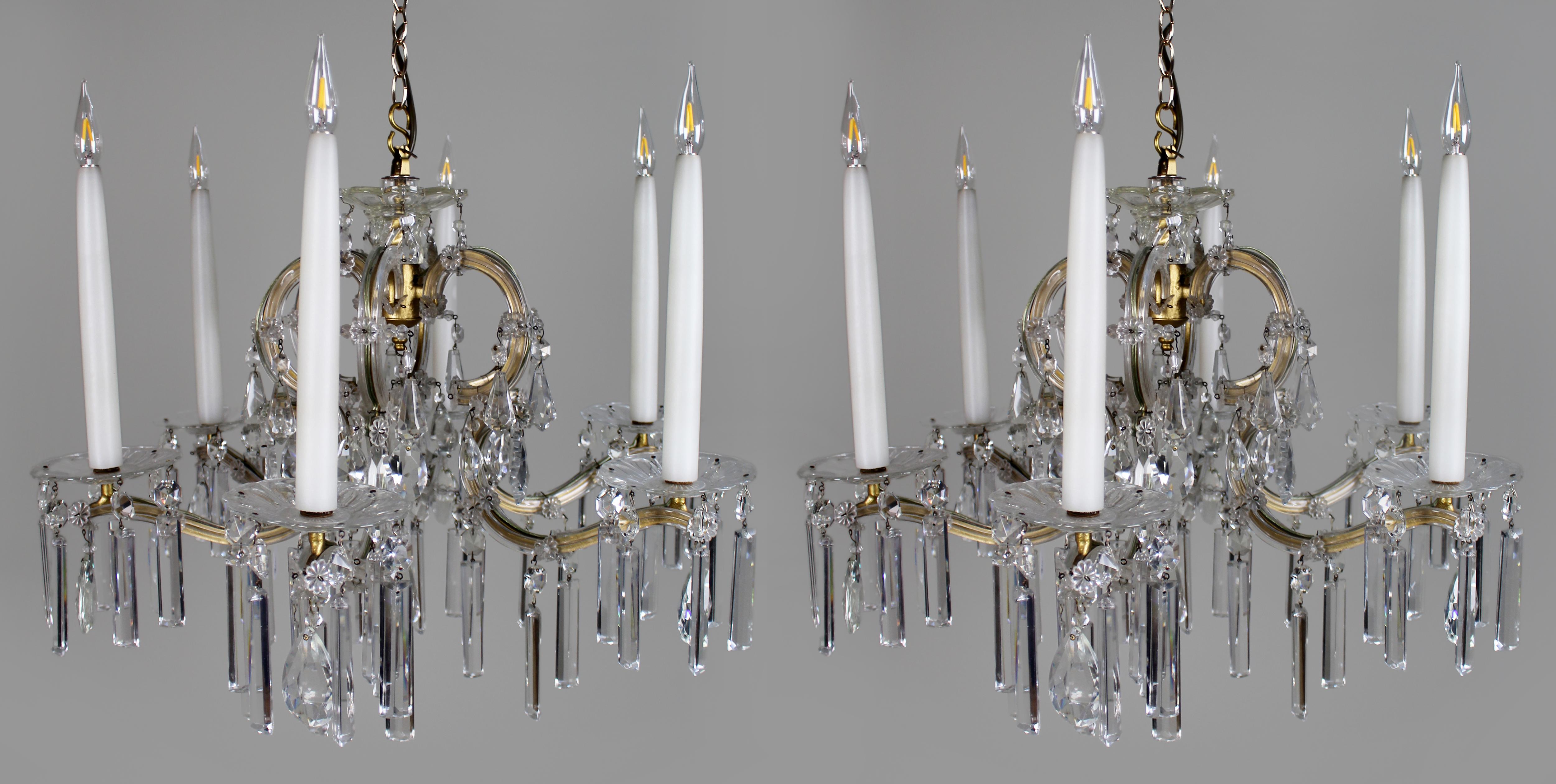 Pair of Mid-Century French Style Eight-Light Crystal Chandeliers
An elegant and well-matched pair of eight-arm chandeliers in the French taste, dating to the mid-20th century, circa 1950s–60s.

Each chandelier features a gilt metal frame with