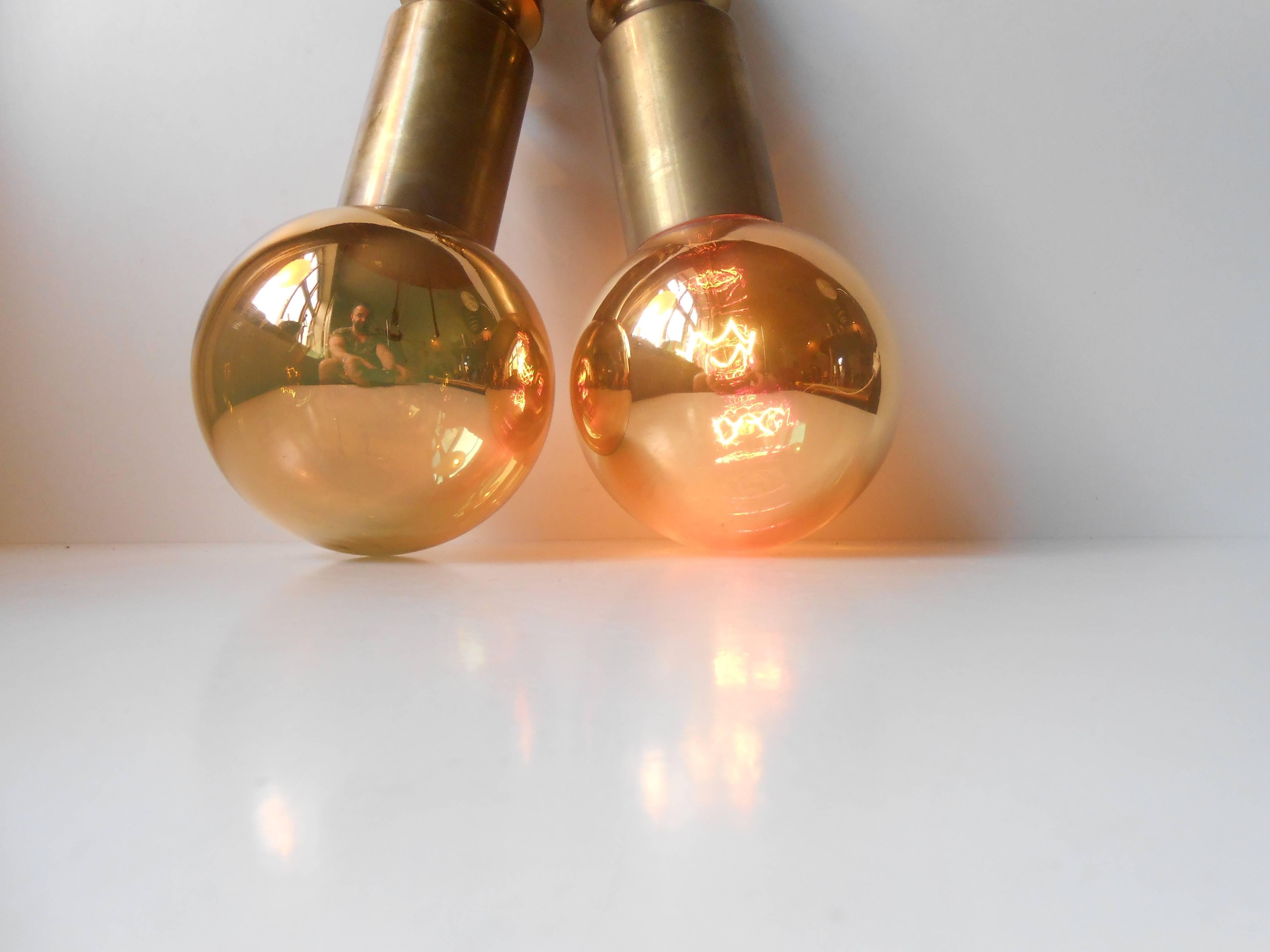 Rare pair of Frimann Goldstar pendant lamps manufactured by Philips in the 1970s. Both mounted with original bulbs from the period - claimed to be everlasting. An additional feature is that the bulbs reflect its surroundings when un-lid.
