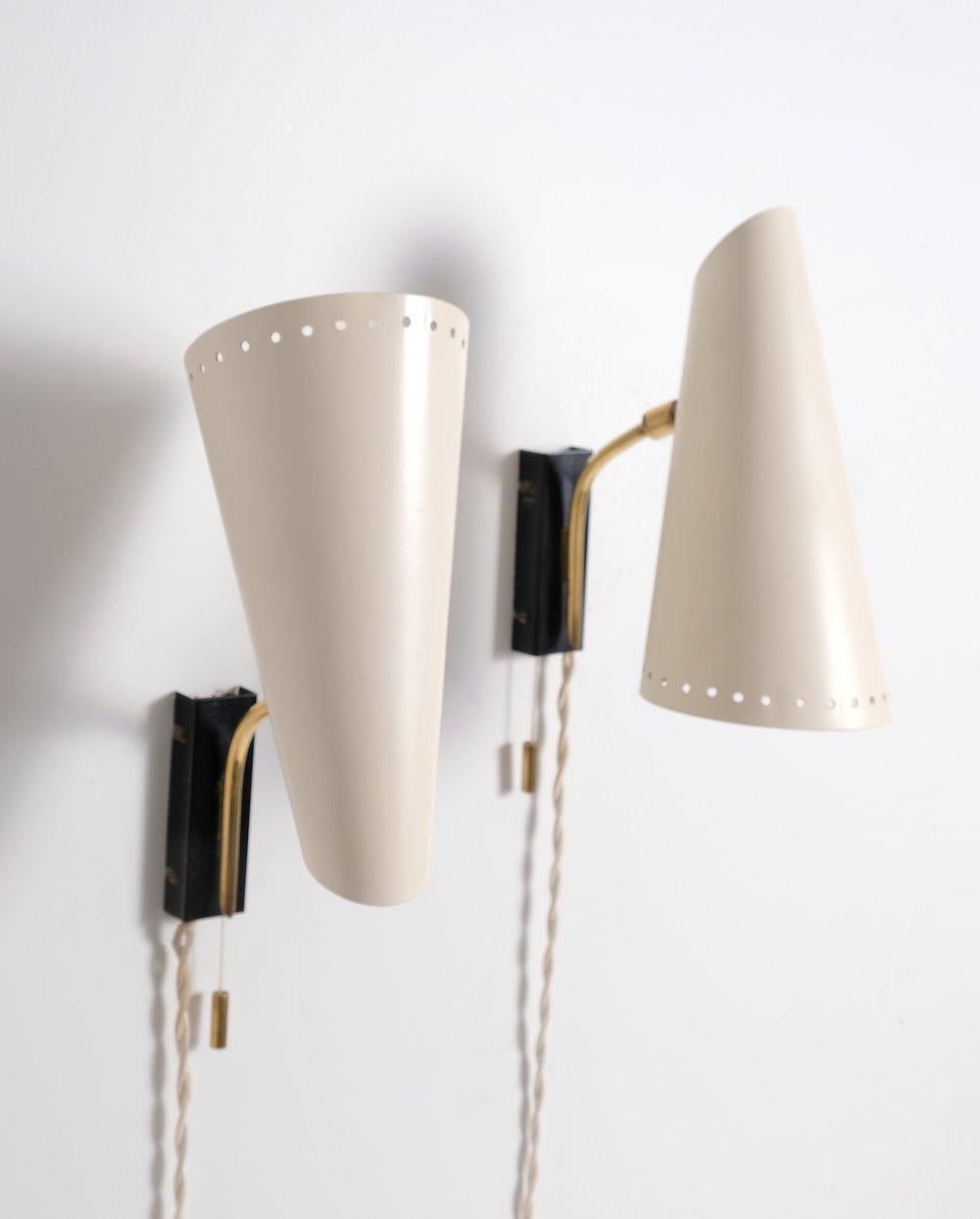 Pair of midcentury German Bedside Lamps or Sconces. Sold as pair. 40 watts E-26 Edison medium base incandescent bulb recommended or higher if LED/CFL.

 Rewired with E-26 Edison base sockets, 18/2 cream coloured cloth cord and polarized north