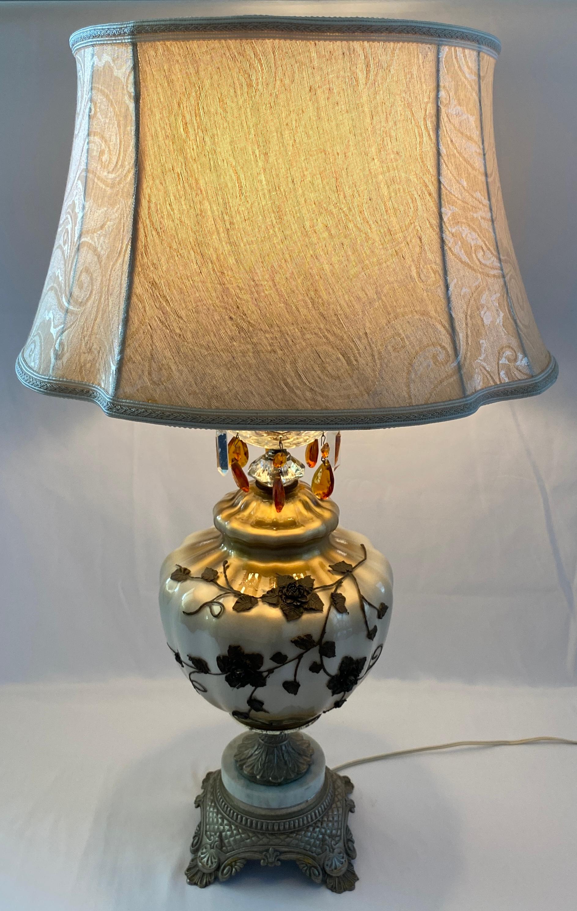 A nice pair of mid-century Opaline glass table lamps in the classical style. 
This good quality pair of table lamps feature custom lamp shades made of a silk blend. The lamps feature brass and marble bases. 

Place these in any traditional setting