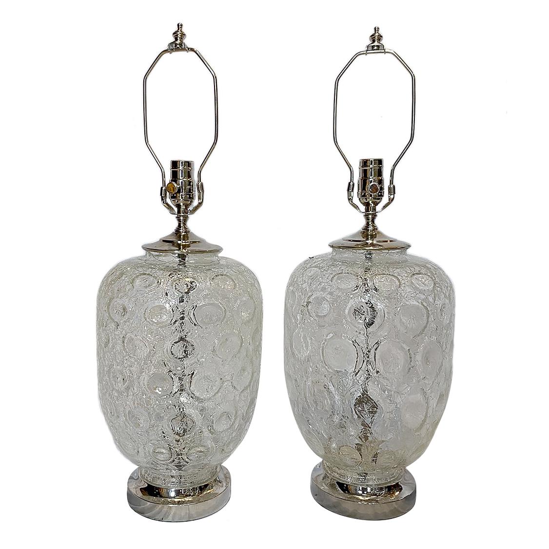 A pair of circa 1960s Danish molded glass table lamps with bubble pattern and silver plated bases.

Measurements:
Height of body 15
