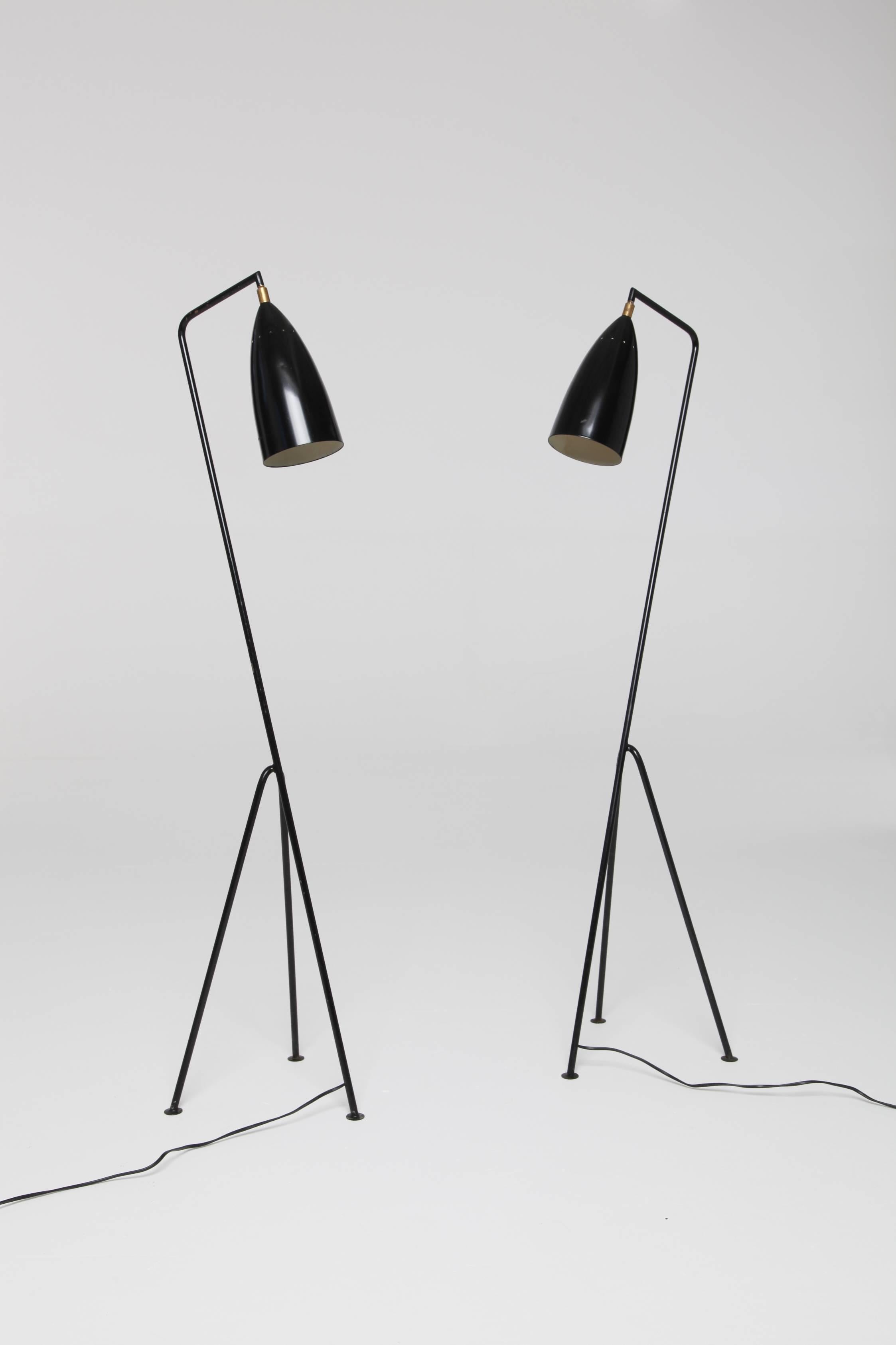 A pair of midcentury 'Grasshopper' lamps in the manner of Greta Grossman, probably Italian, 1960s-1970s. Perforated lampshade. Original lacquered steel, some minor paint loss. Wired for EU (and will ship with an EU to US adaptor plug). 
Measures: