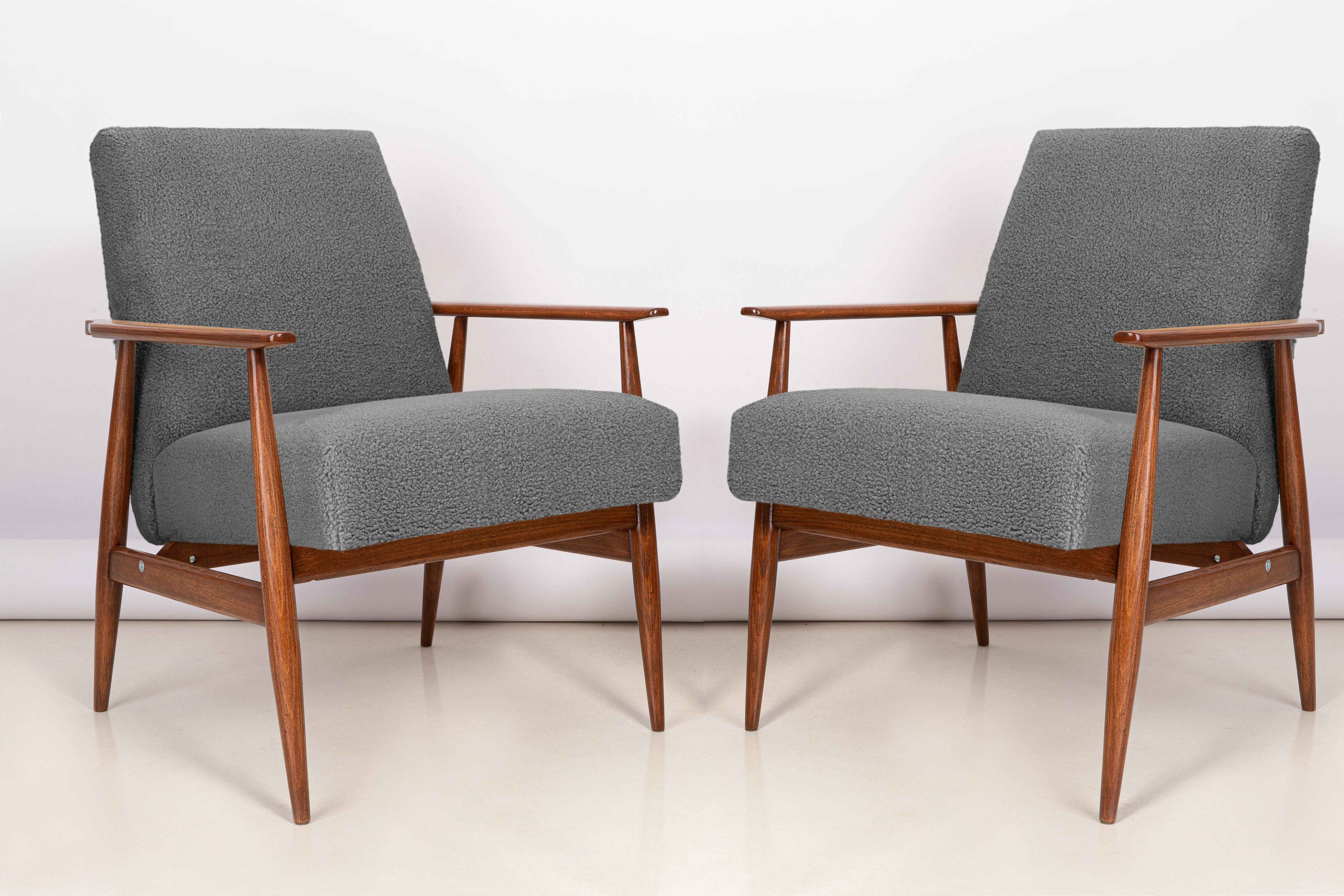 A pair of grey bouclé armchairs, designed by Henryk Lis in 1960s. Furniture after full professional carpentry and upholstery renovation. The armchairs will be perfect in Minimalist spaces, both private and public. 

Upholstery - faux fur has a