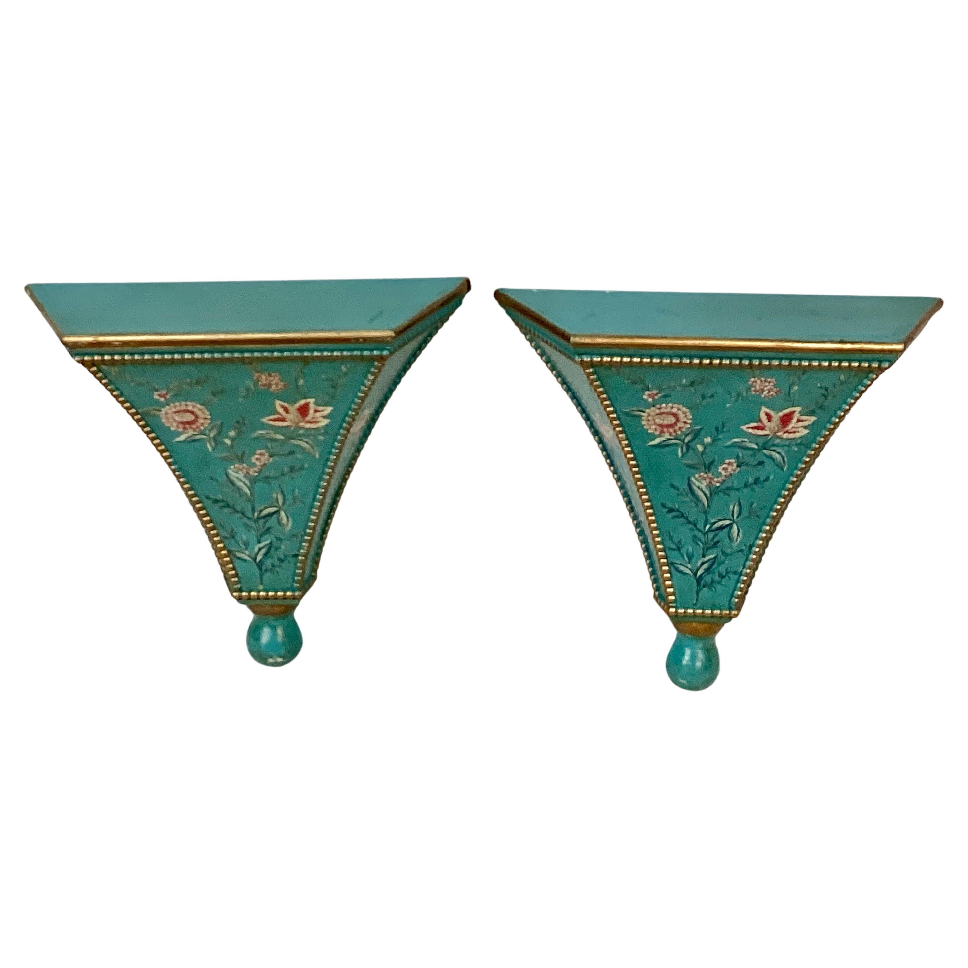 Pair of mid-century beautifully hand-painted wall brackets/sconces. Wall brackets have gold trim with foliage and pink florals on a turquoise background. Wide 5.5