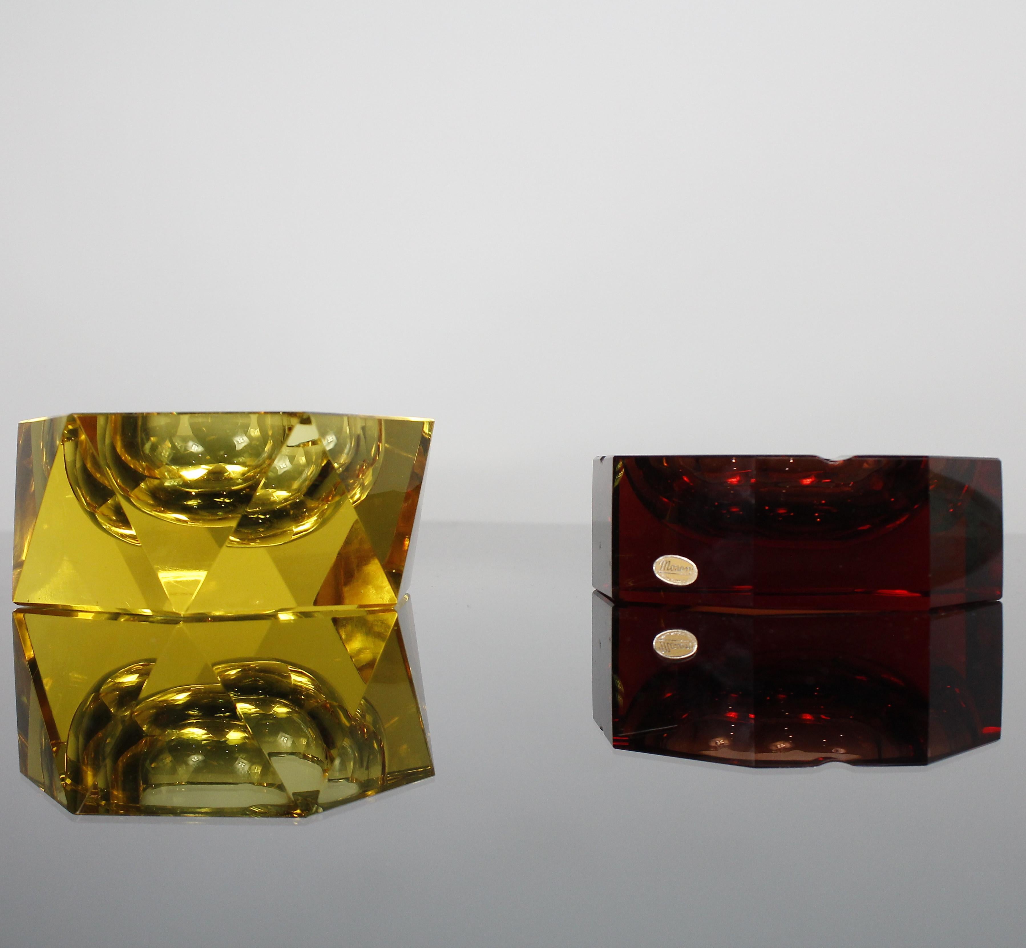 Pair of refined Moser Art Deco handcut glass ashtrays in very fine and intense colors, amber and yellow by Moser, circa 1940.

They are both signed but only the amber ashtray has the label too.

In excellent original condition.

Measurements