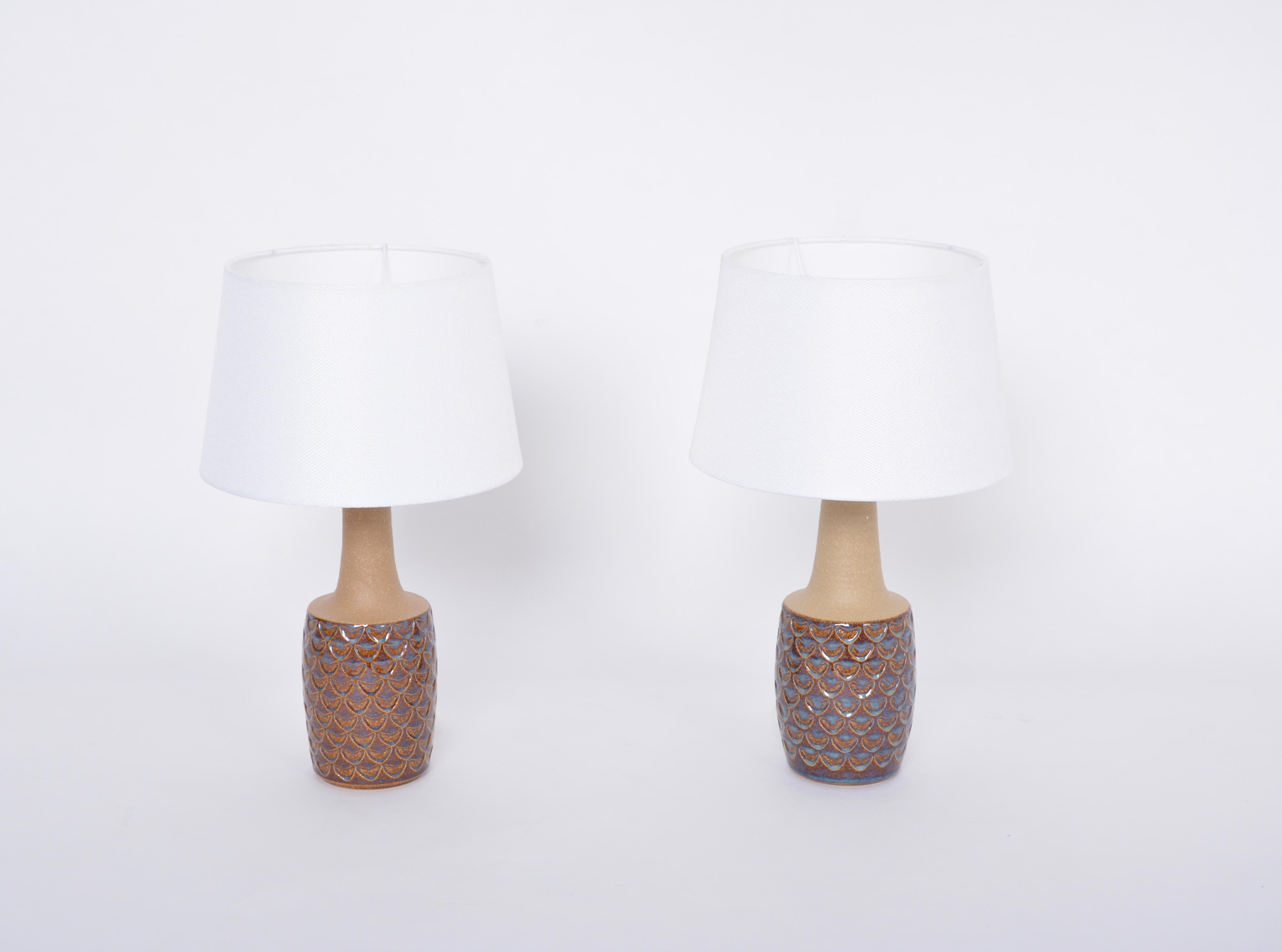Pair of midcentury Handmade Stoneware table lamps model 3001 by Einar Johansen for Soholm

This pair of stoneware table lamps was designed by Einar Johansen and handmade on the Danish island of Bornholm by the company Soholm Stentoj (stoneware in