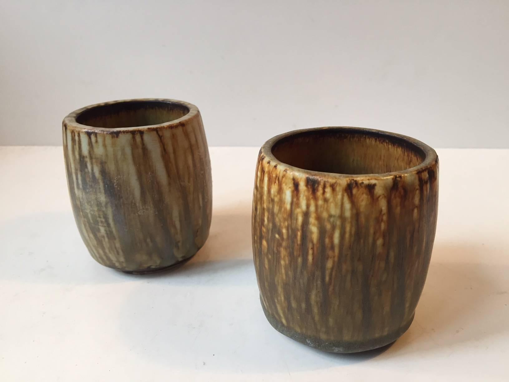 This matching pair of small ceramic vases with taupe-brown hares fur glaze was designed by Gunnar Nylund and created in the workshop at Rörstrand in Sweden during the late 1950s.