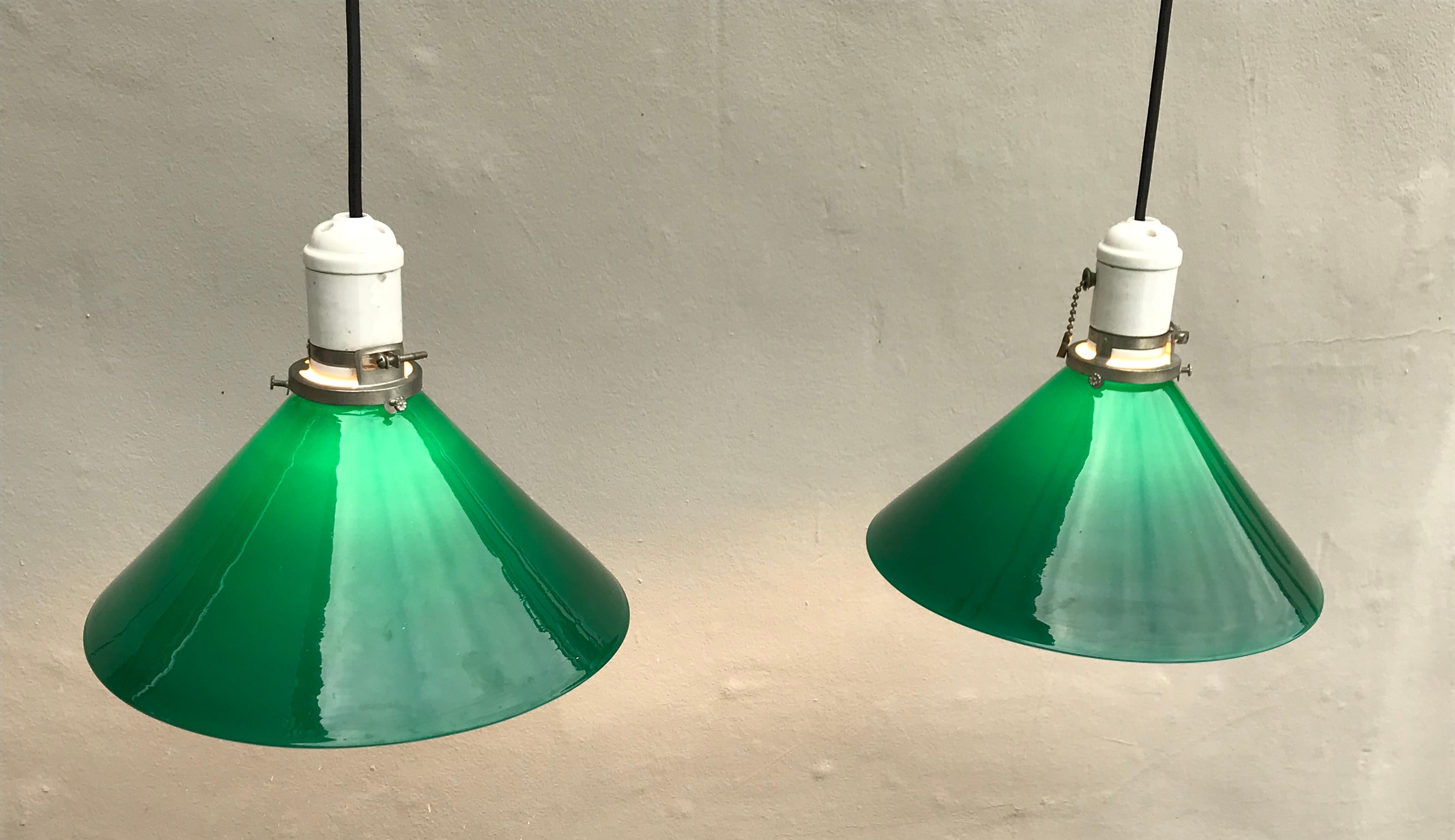 Very cool pair of mid century German industrial pendant lights in vibrant green glass. Rewired.