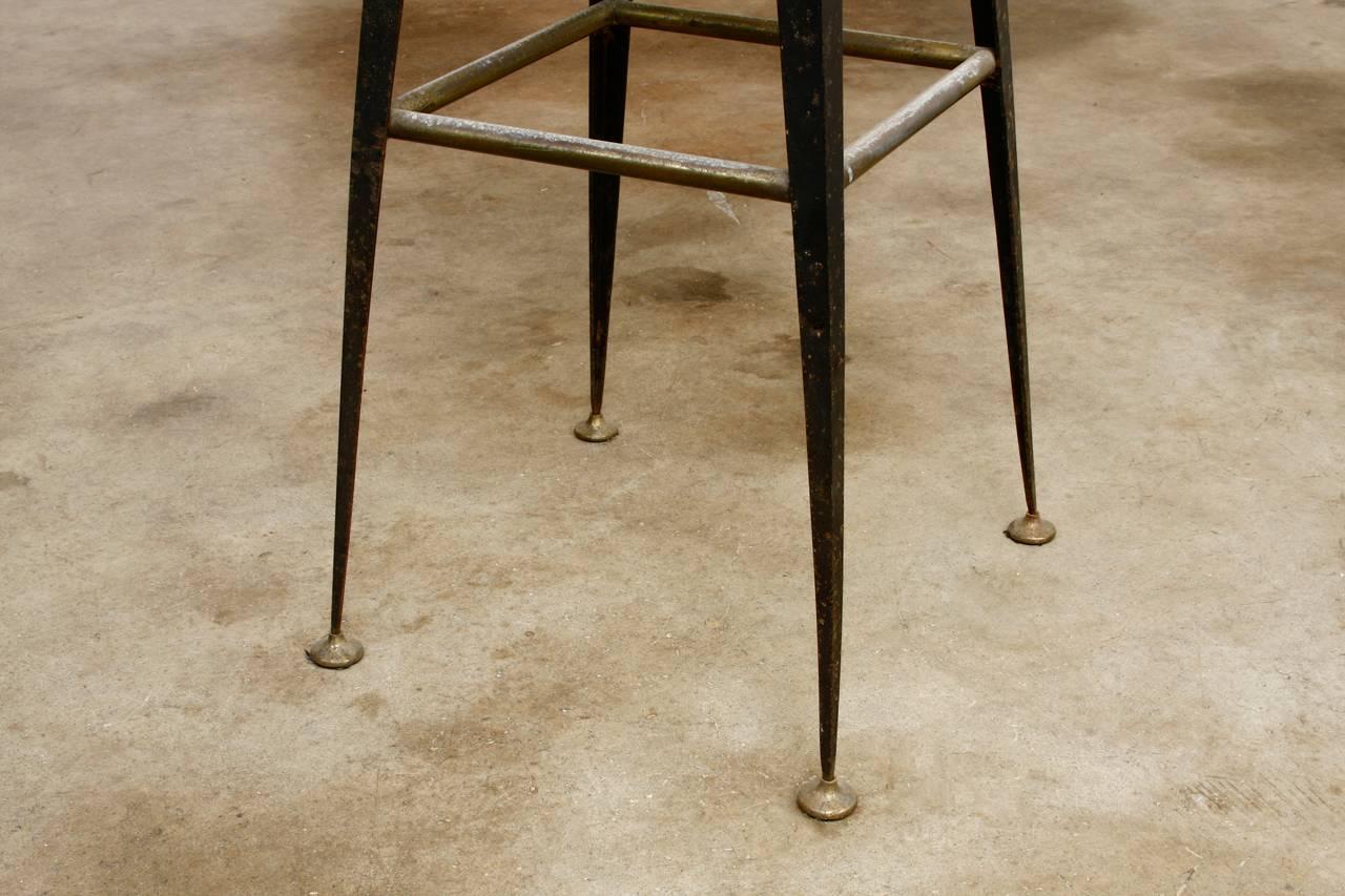 Pair of Midcentury Industrial Iron and Vinyl Barstools 1