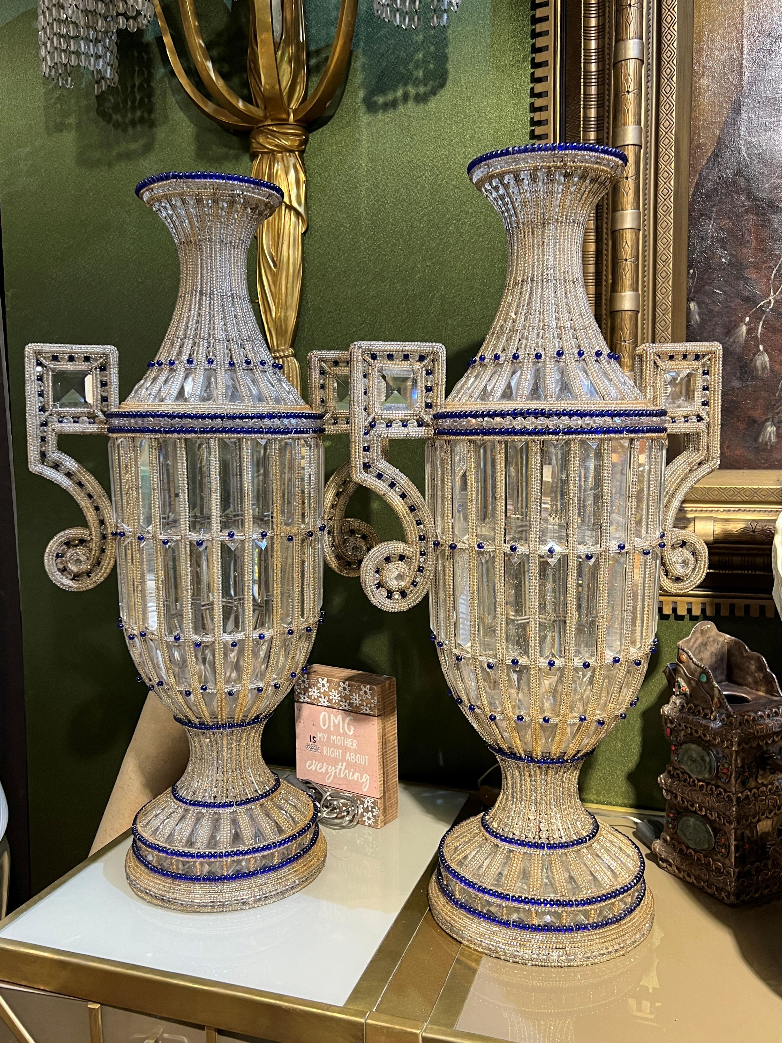 Our lighted glass vases of Italian origin, circa 1950s, are crafted of colorless, faceted glass and glass beads plus beads in royal blue that accent the rims, shoulder, waist and base. With their original ceramic sockets and modern L standard