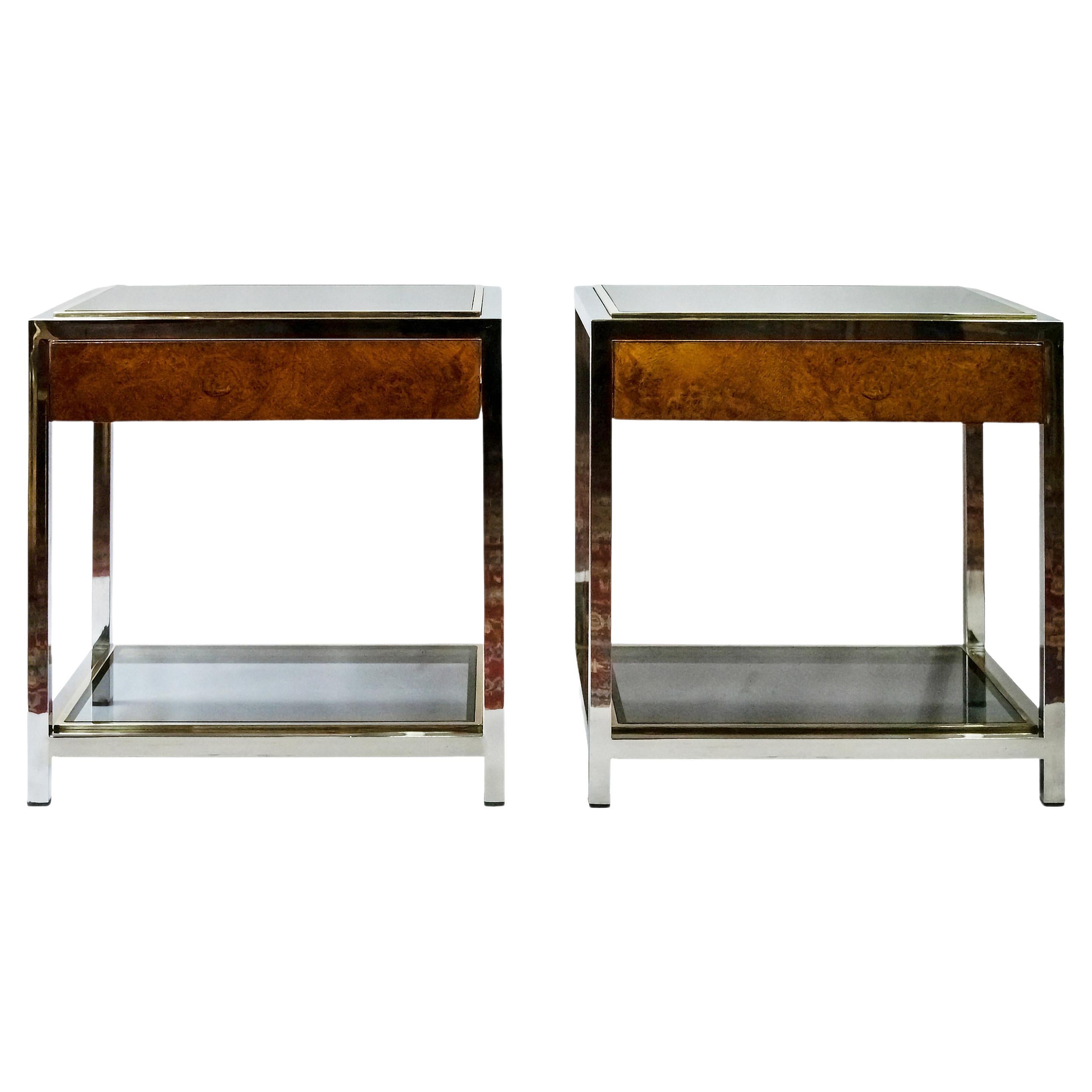 Pair of Italian bedside night stands/tables from 1970s in Romeo Rega, Willy Rizzo style.
The construction is in chrome and brass with glass top and glass shelve.
Each table includes one wood and veneer drawer.
Very good vintage condition.
