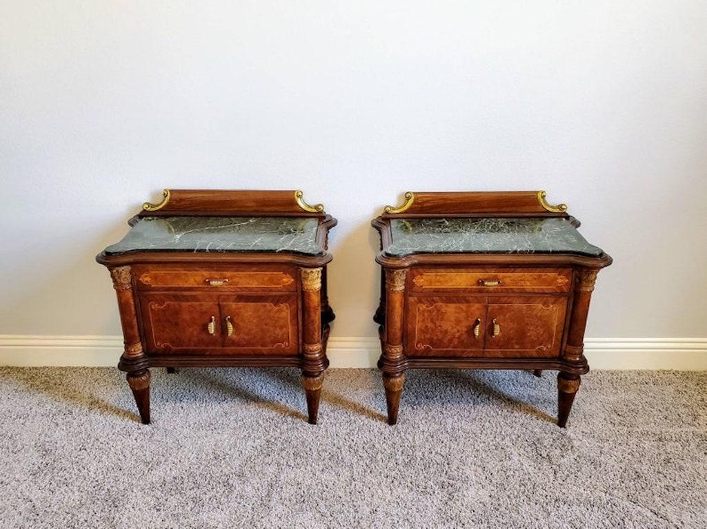 A superb pair of handmade mid 20th century burlwood bedside cabinets. Fine quality, exquisitely decorated, featuring shaped top with original inset verde marble tops, partial gilt raised backsplash, front of case with foliate marquetry and string