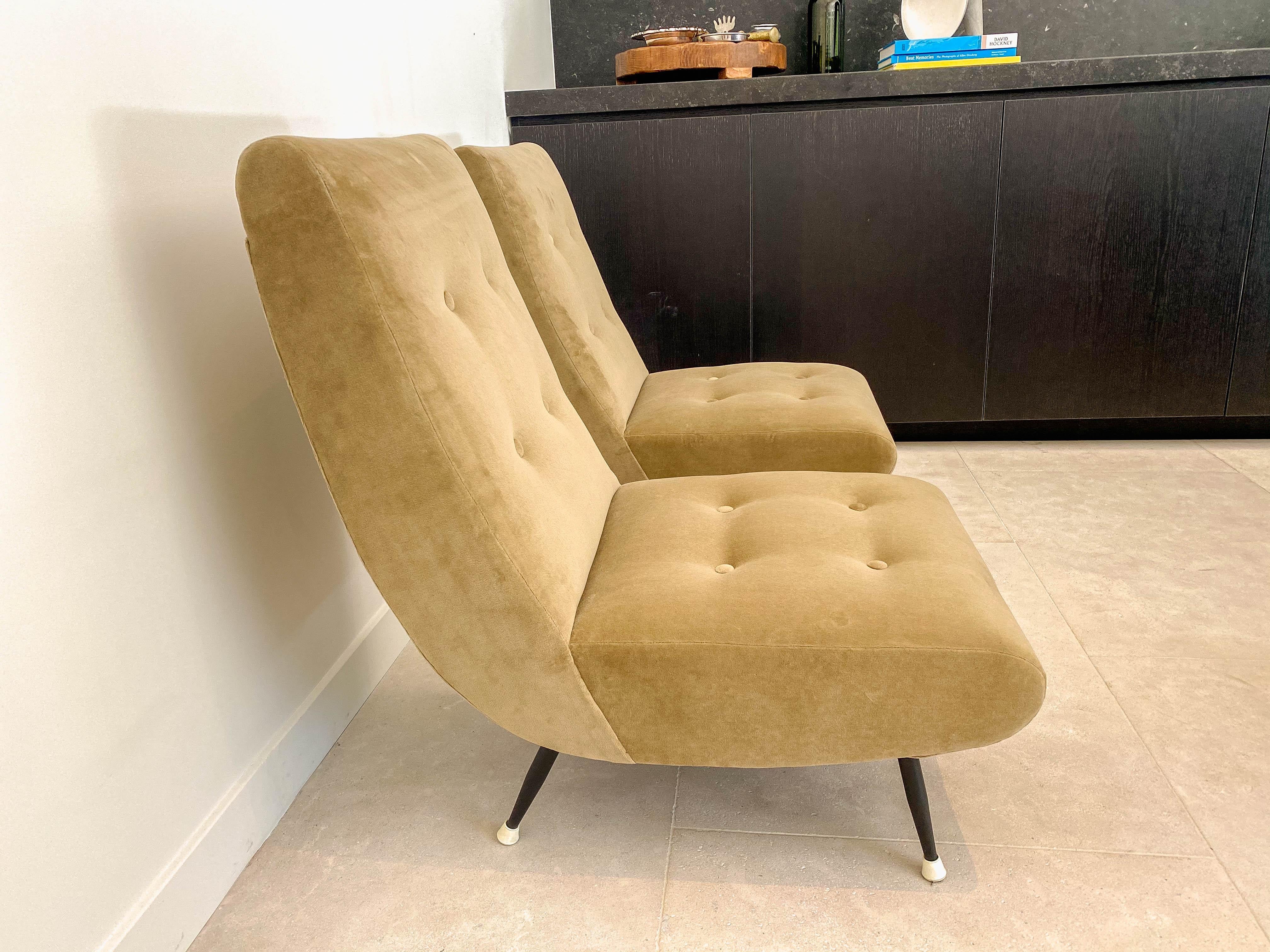 Pair of Mid-Century Italian chairs in a creamy green velvet with original metal work and footing.