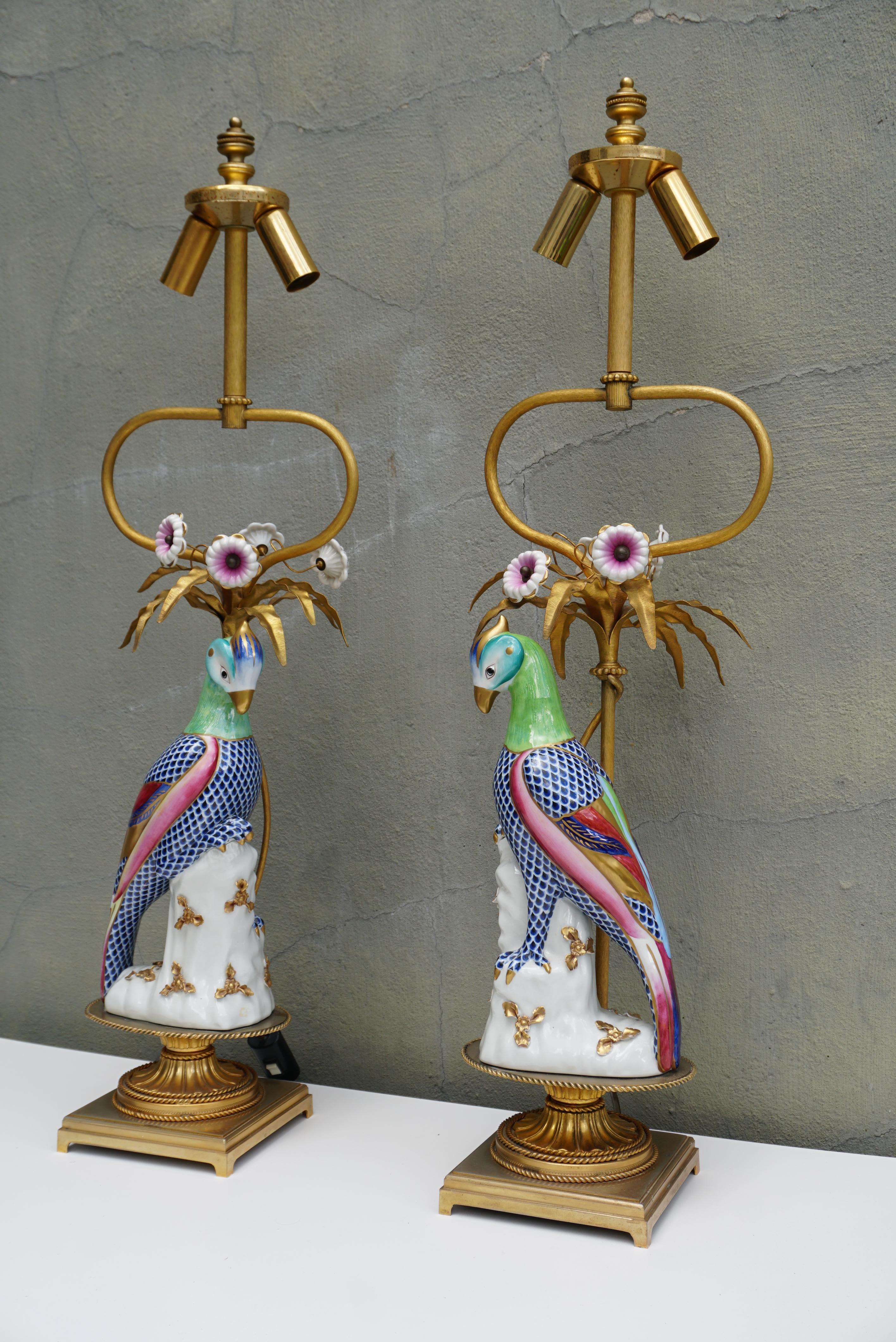 Pair of Mid-century Italian Mangani signed porcelain faience parrot bird and flower table lamps.

Stunning Giulia Mangani - Italian Tole lamp with exotic Bird - Sèvres style porcelain - With flowers. 
1970s 

Height 31.8