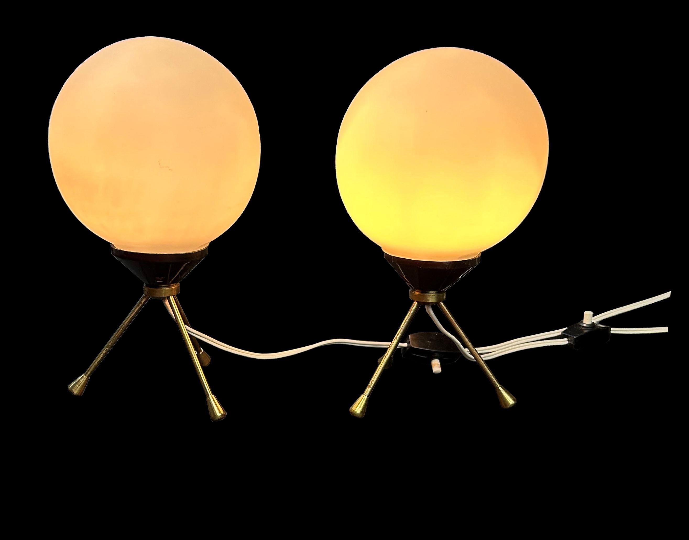 These are a lovely pair of Italian '50's lamps, both in great condition and working perfectly.We haven't yet been able to find the designer, but they are similar to many designs from the period.