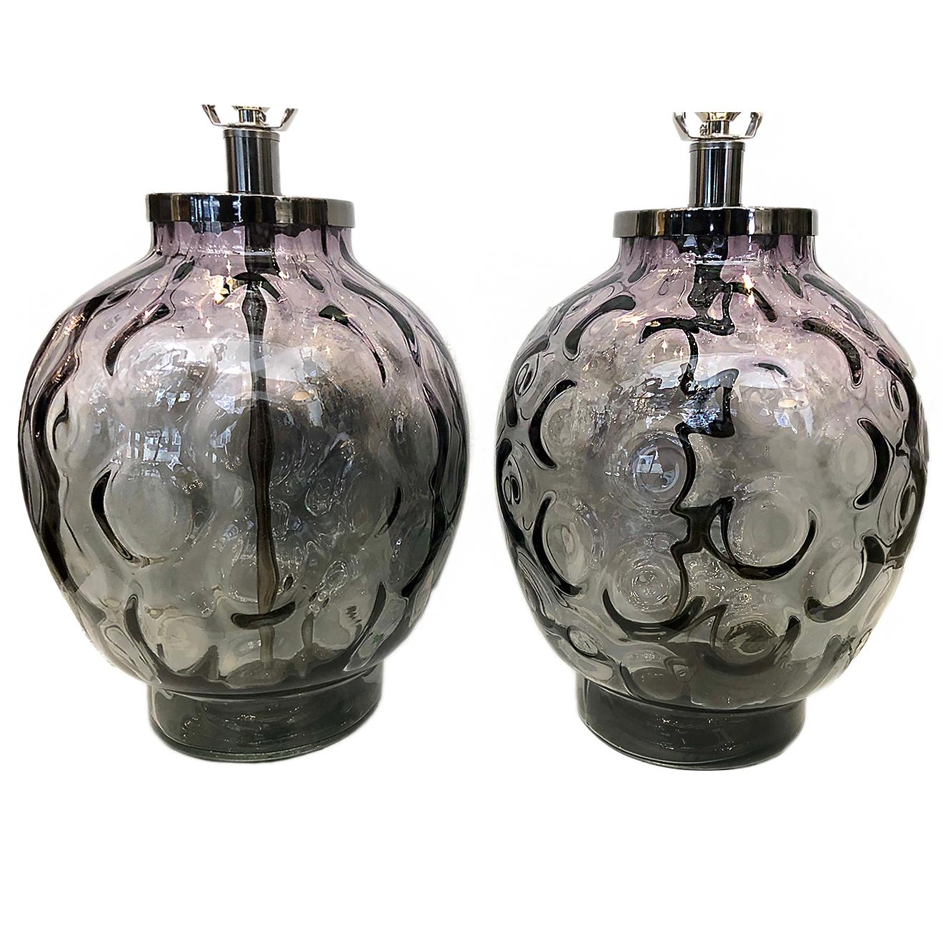 A pair of circa 1960’s Italian optical ombre glass table lamps.

Measurements:
Height of body: 14.25″
Diameter: 11″
Height to shade rest: 24″