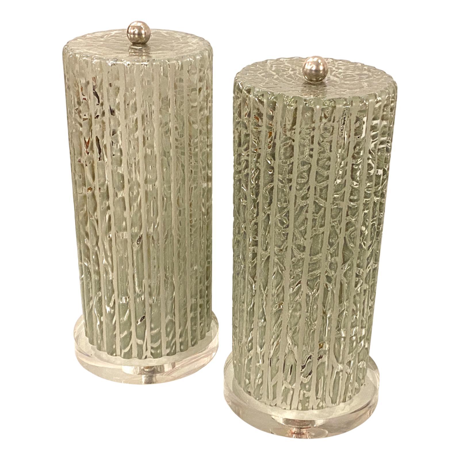 Pair of circa 1960s Italian enclosed hurricane molded glass lamps with interior light, Lucite bases and nickel-plated finial.

Measurements:
Height 15.5