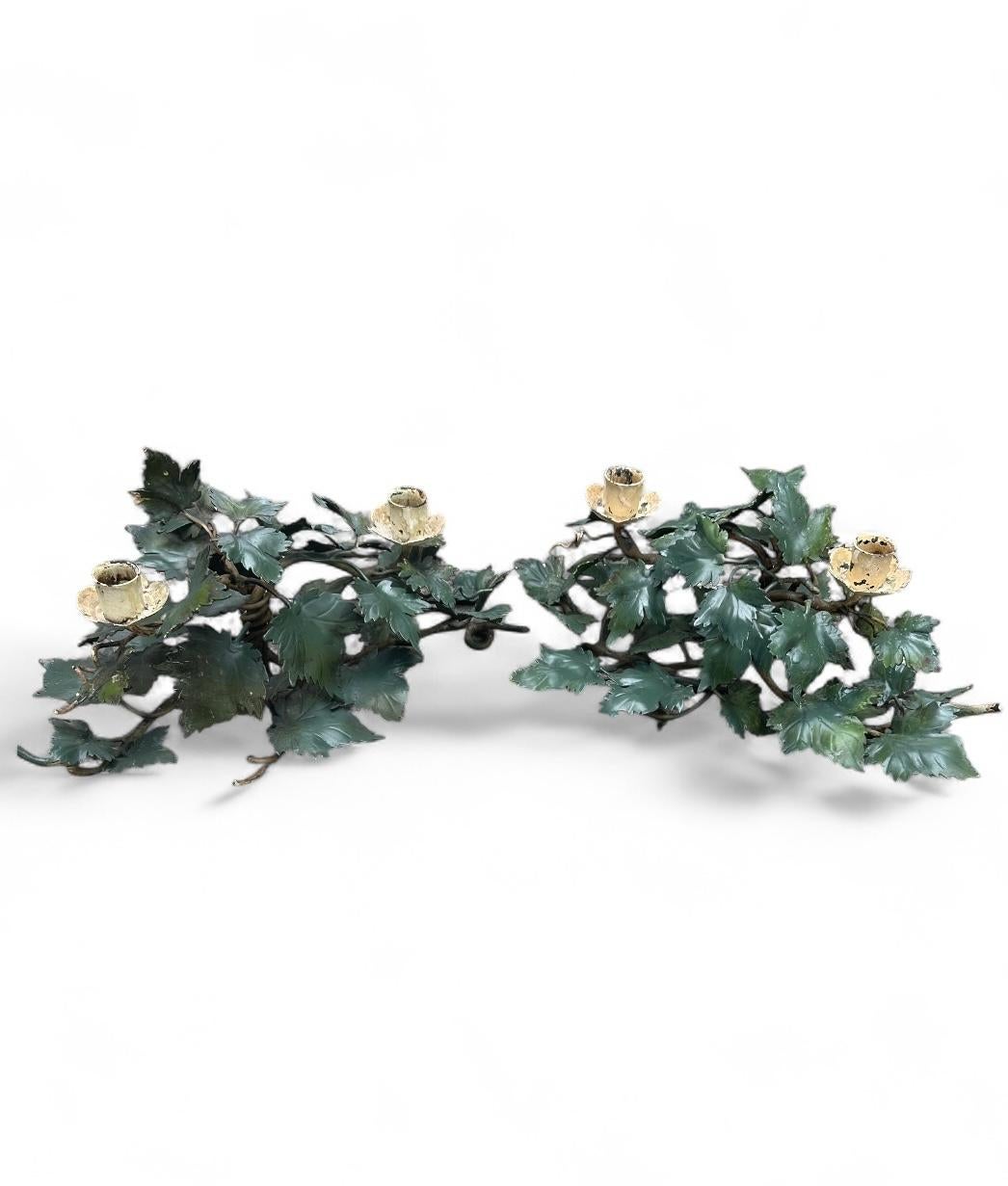 Pair of Mid-Century Italian Hand Painted Tole Ivy 2-Cup Candleholders.

Pair of vintage Italian hand painted tole 2-light candleholders. Each is naturalistically designed with clustered branches and a profusion of leaves.   The centerpiece tabletop