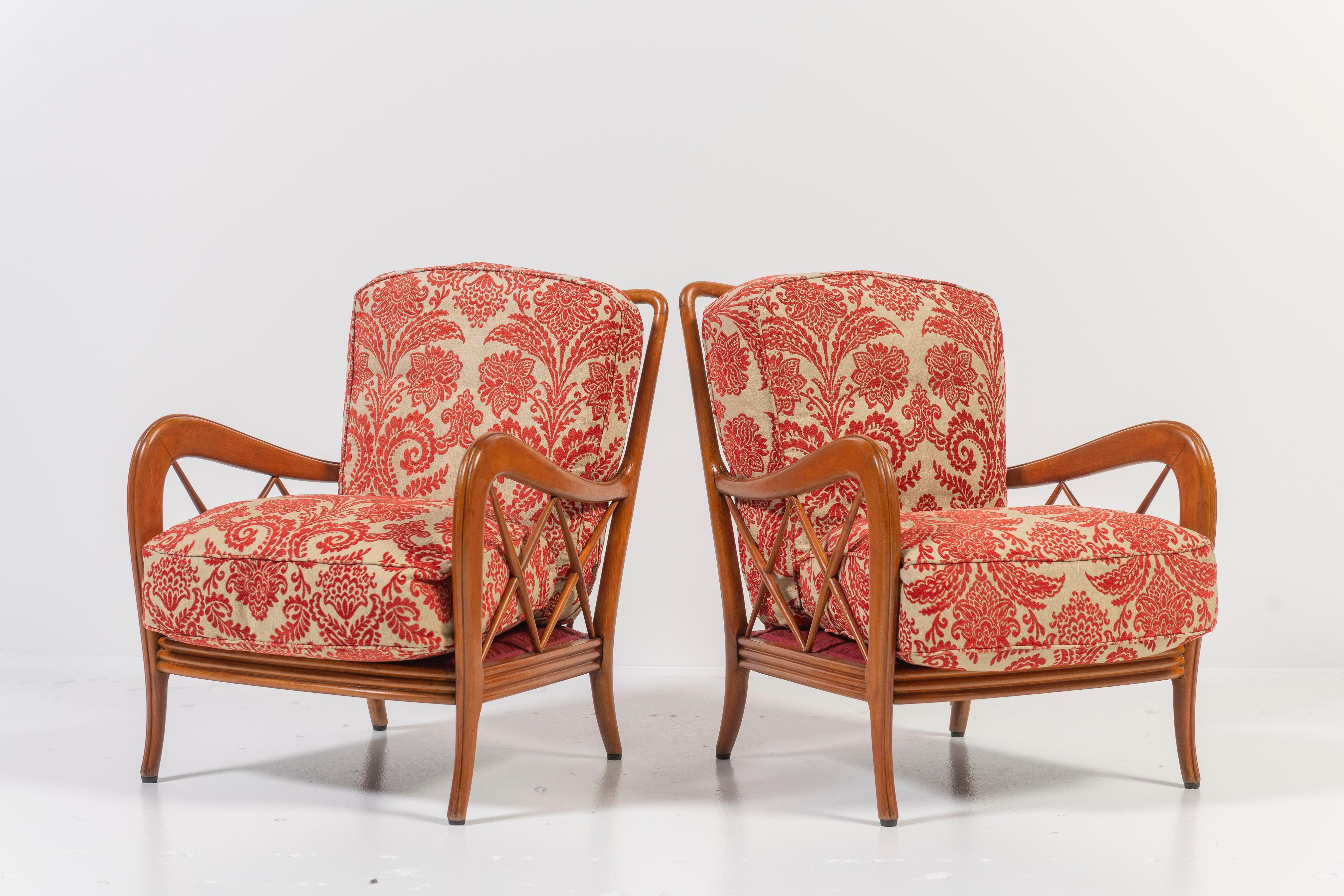 This classic pair of Paulo Buffa lounge chairs are elegant, comfortable and beautifully made in cherry wood.  The ergonomic design and craftsmanship create the ideal seating experience. The backrest is comprised of six intricately crafted spindles,