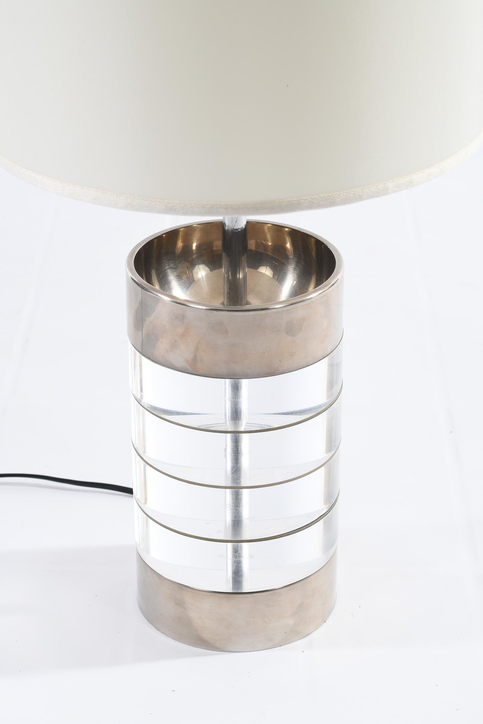 Pair of cylindrical lamps made up of plexiglass elements finished at the base and at the apex by chromed metal.
Italy 1970 midcentury
Newly rewired.
The listed measures are with shades.
