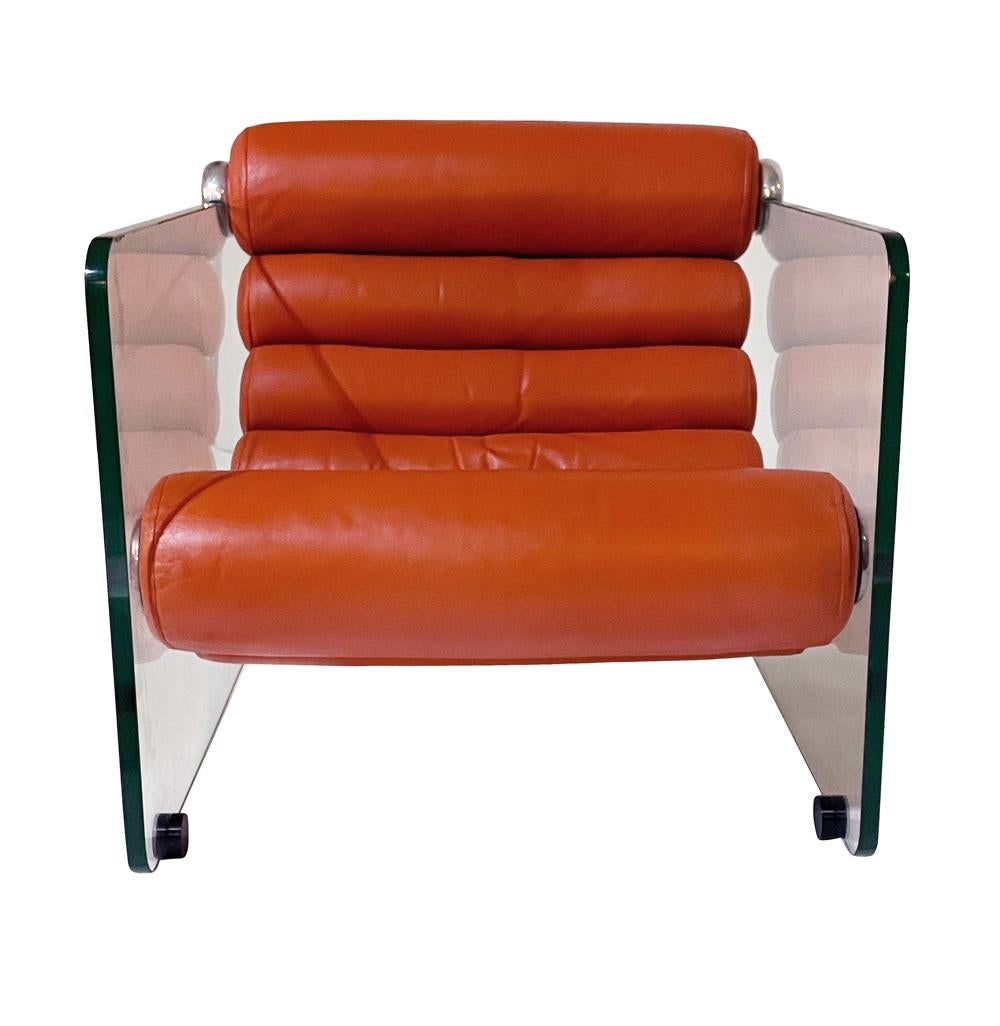 A lovely matching pair of club chairs or lounge chairs designed by Fabio Lenci and produced in Italy circa 1970's. These feature uncommonly seen orange leather cushions in a tubular form. Thick glass walls with aluminum brackets. Leather was