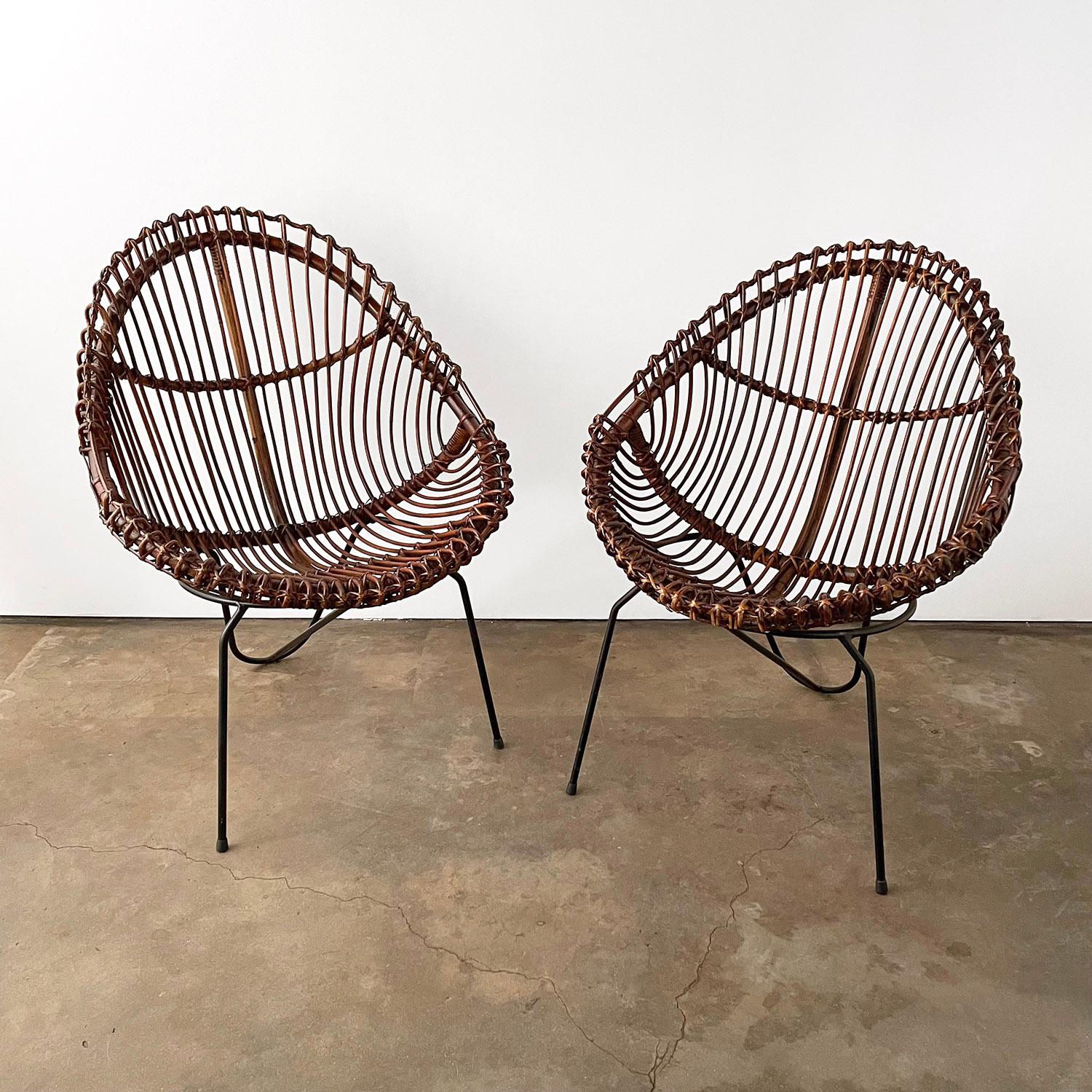 Mid Century Italian Sculpted Rattan & Iron Chairs 
Sculptural handwoven rattan and iron hoop chairs
Black metal curved hairpin base
Patina from age and use
Newly reconditioned 
Timeless classic 
