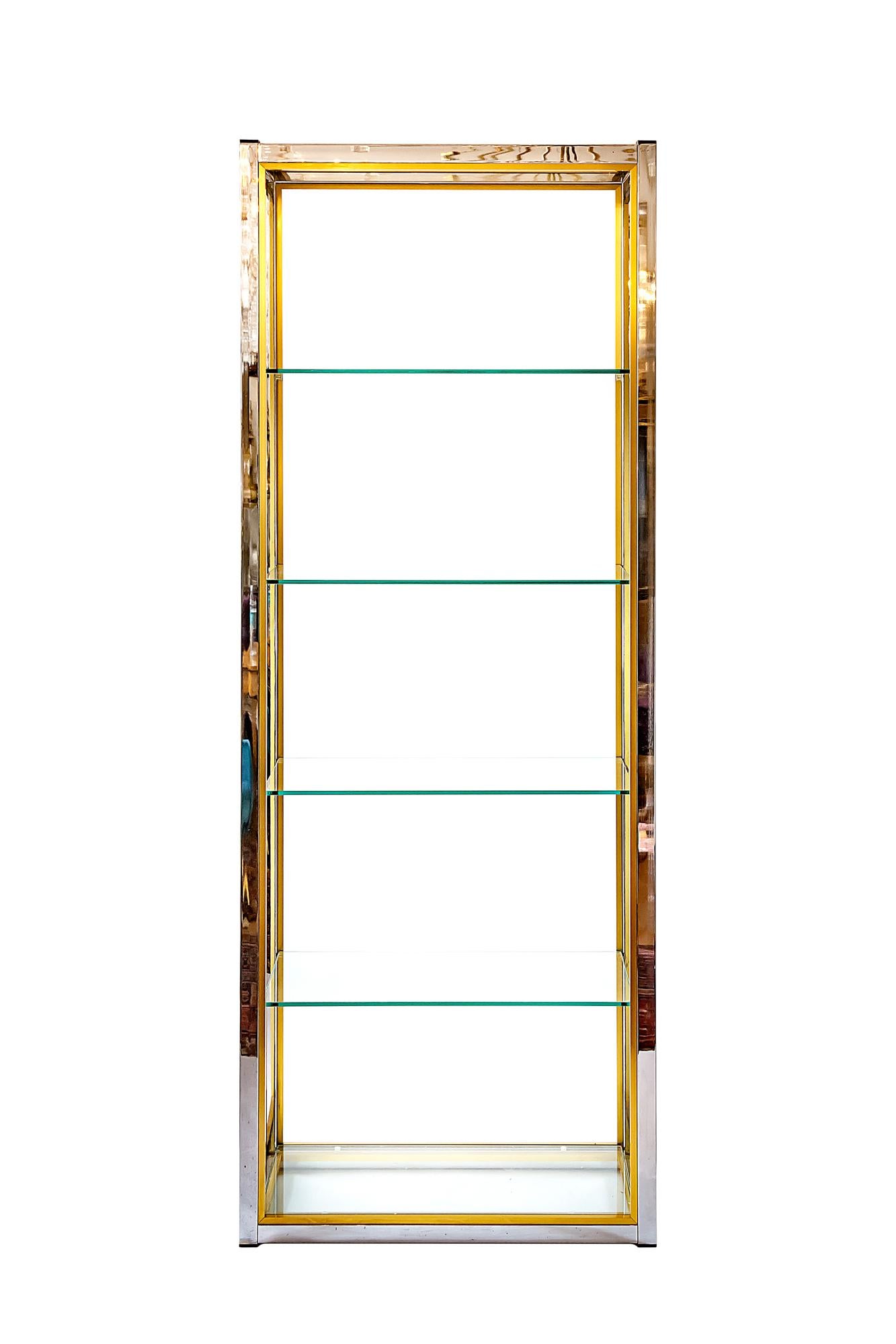 Vintage mid-century pair of shelves by Italian designer Renato Zevi, circa 1970. Perfect condition of chrome surface and brass details and five transparent glass shelves.