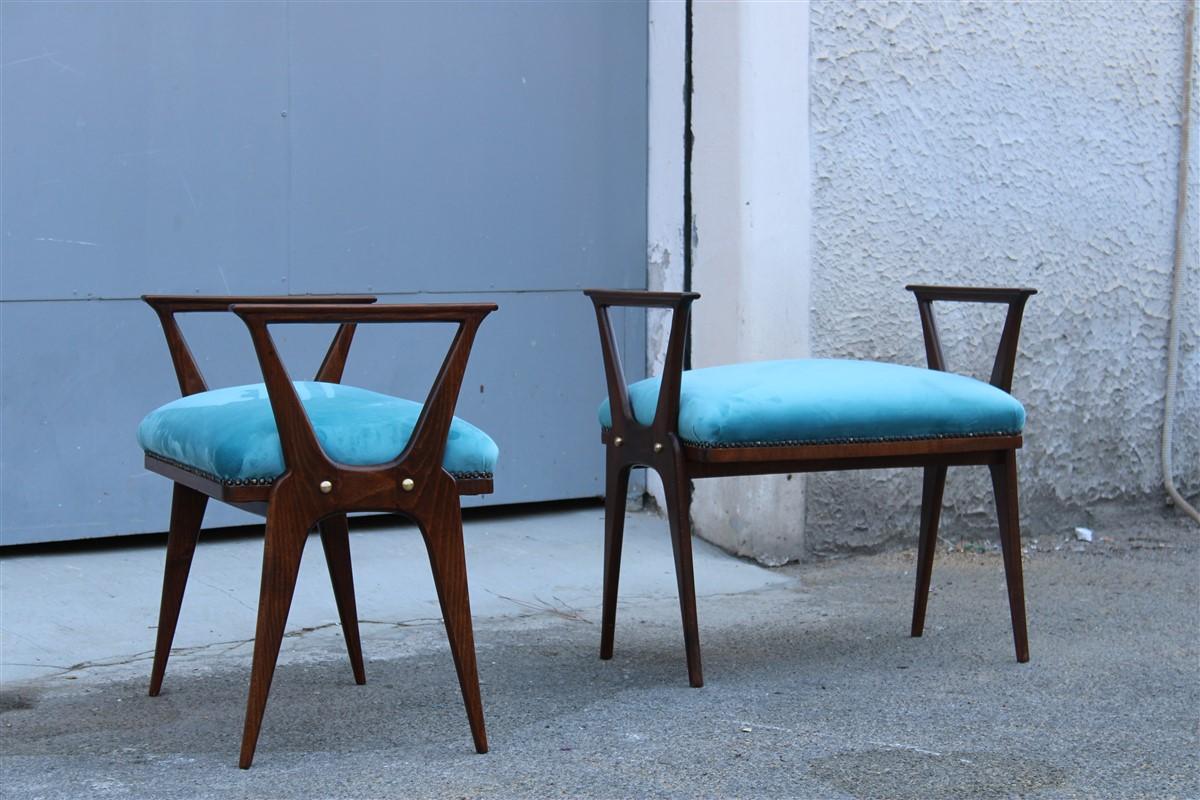 Pair of mid-century Italian stools in walnut and blue velvet, have purely the old Italian character from the past.