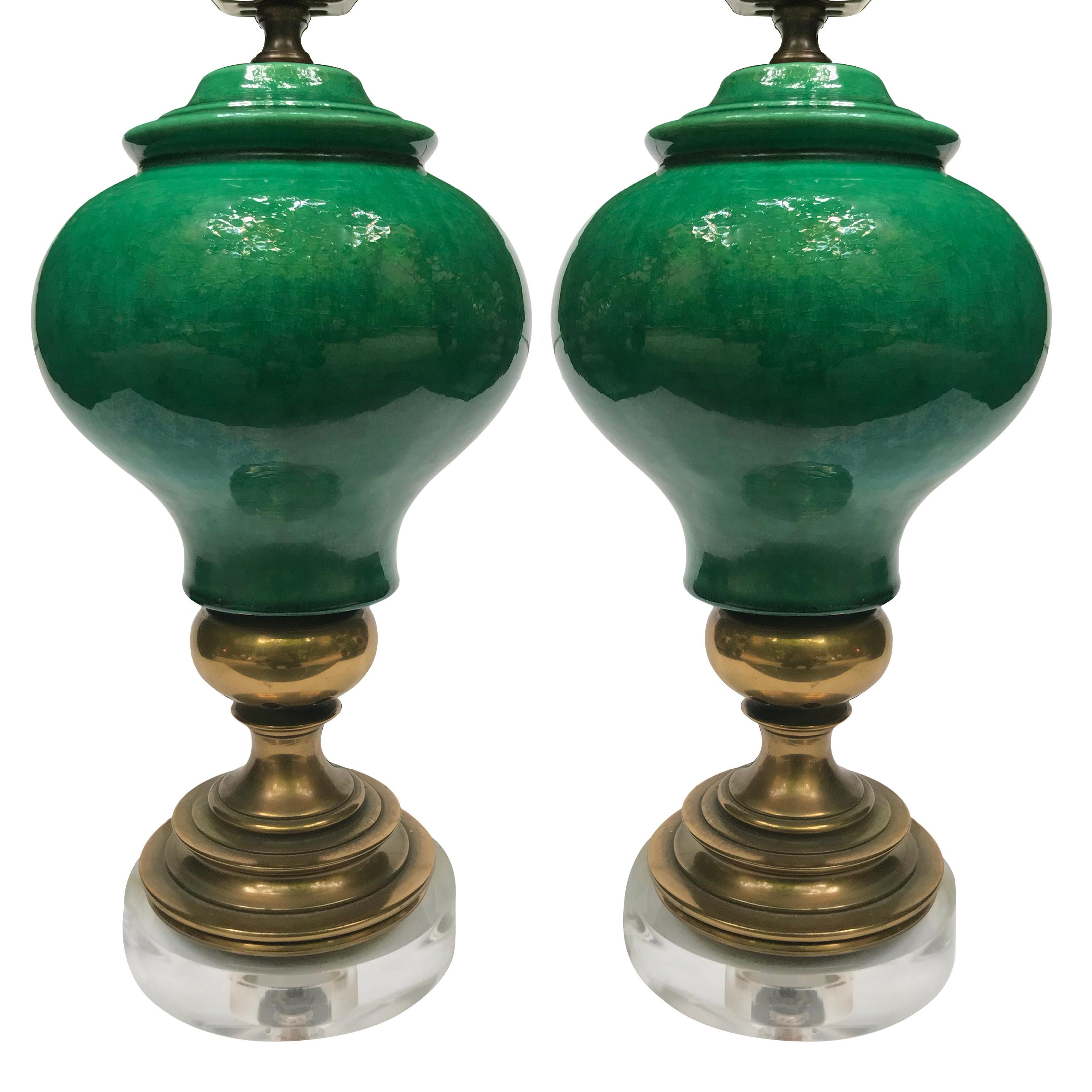 Pair of circa 1950's Italian ceramic table lamps with bronze fittings and lucite bases.

Measurements:
Height of body: 13.75