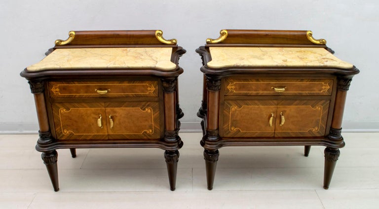 Pair of 1940s bedside tables in walnut wood and maple inlays, shelves in cream Valencia marble and brass finishes. They have been completely restored, as can be seen from the photos.