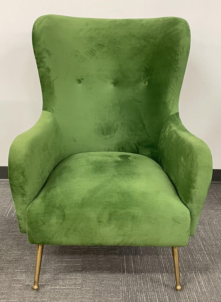 Pair of Mid-Century Italian Wingback Arm Chairs, Green Velvet, Gilt Metal Legs. Each in a nice Green Velvet upholstery on Gilt Metal Legs. Both having high tufted backs.
Seat height: 16


1HXX
