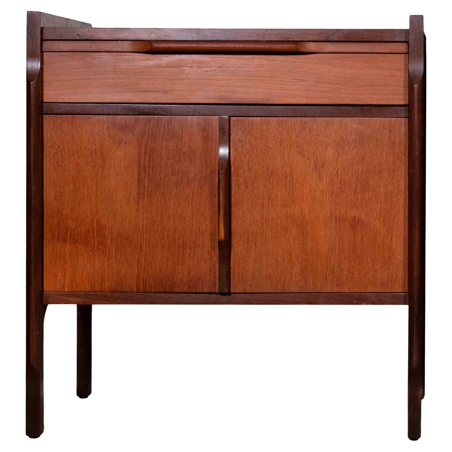 Pair of mid-century Italian wooden bedside tables is an original design furniture realized in Italy in the mid-20th century.

 A vintage bedside tables with two doors and a drawer each one. 

Collect a vintage design item and give a touch of