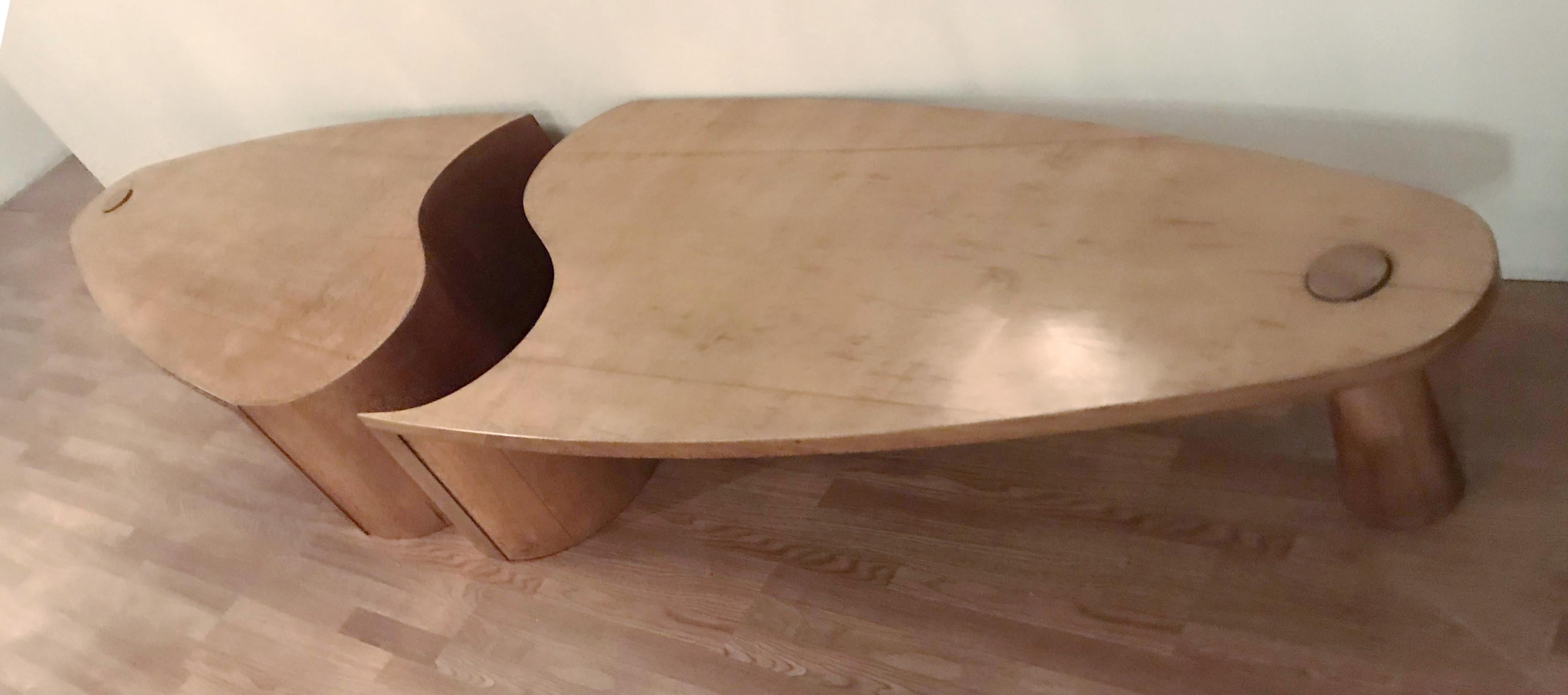 Vintage wooden coffee tables originally from a hotel lobby in Northern Italy, made in the 1960s. This pair of tables can be placed separately or together to form a single table, and has large curved tops with cone shaped legs, in the style of Angelo