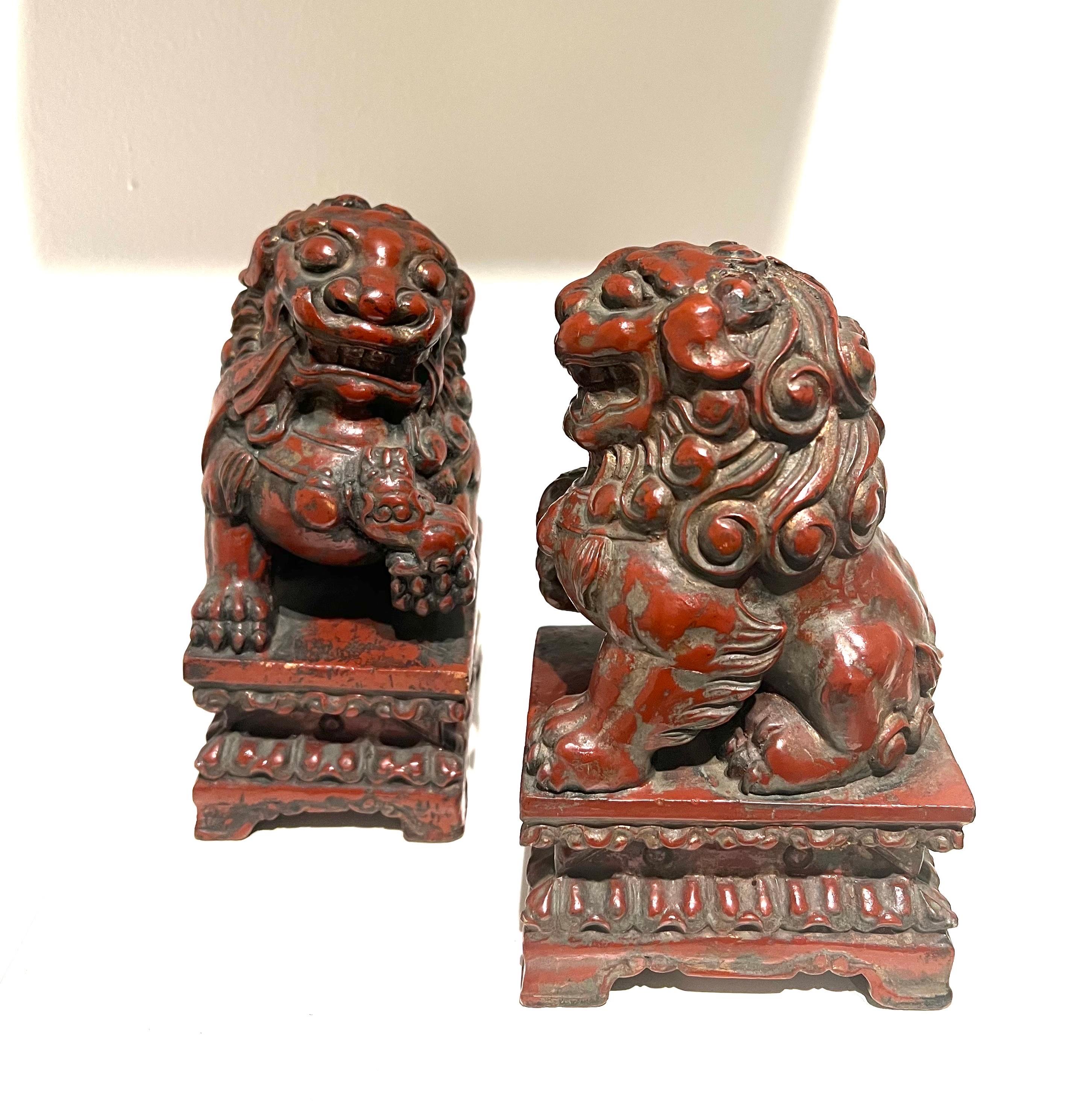 A very nice pair of vintage, red lacquered wood carved foo dogs from Japan. Excellent condition and patina; make a fun decor item in any room!