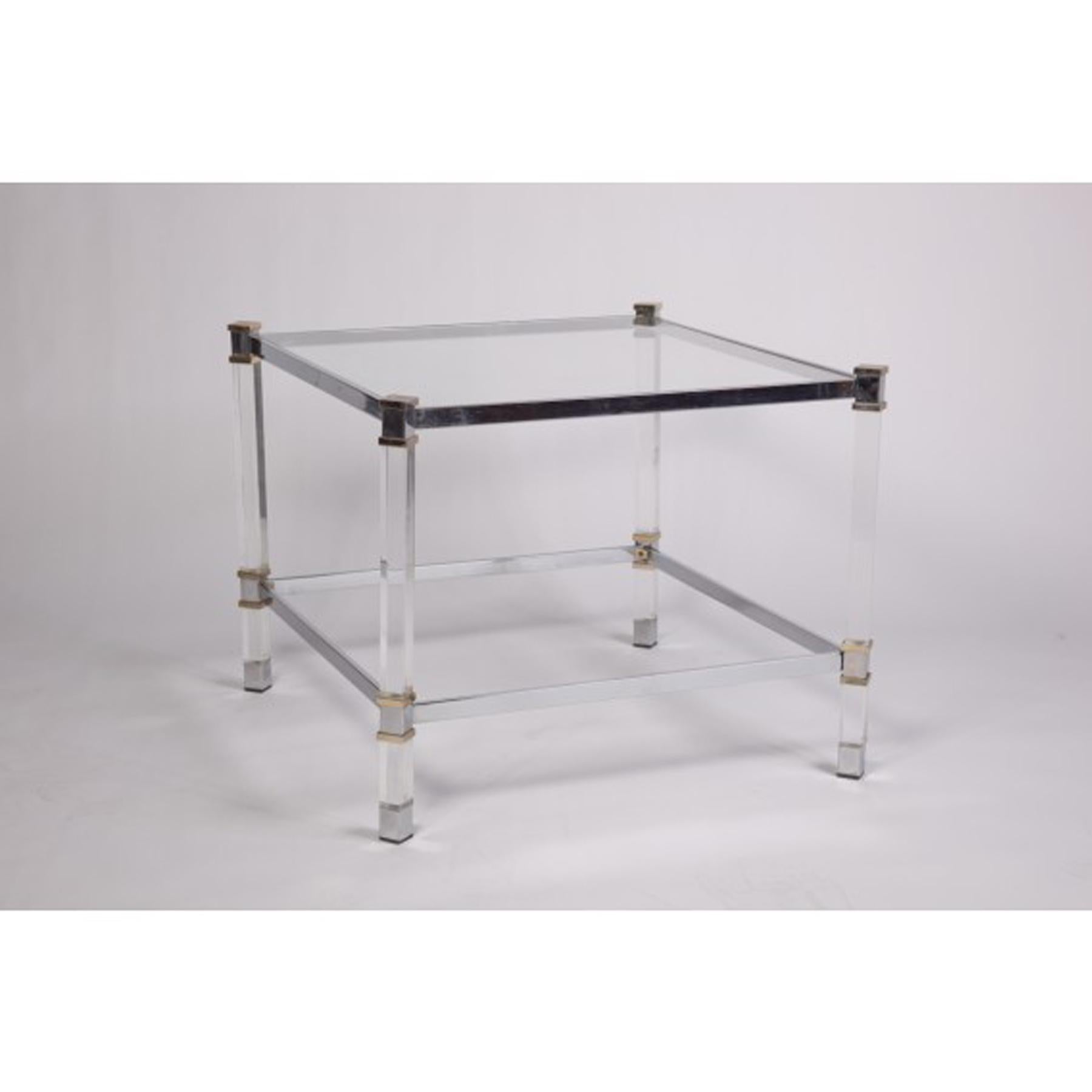 Pair of stunning lucite and chrome occasional tables. Brass details on corners add sophistication and charm. Glass top set into chrome frame. Thick square lucite legs.