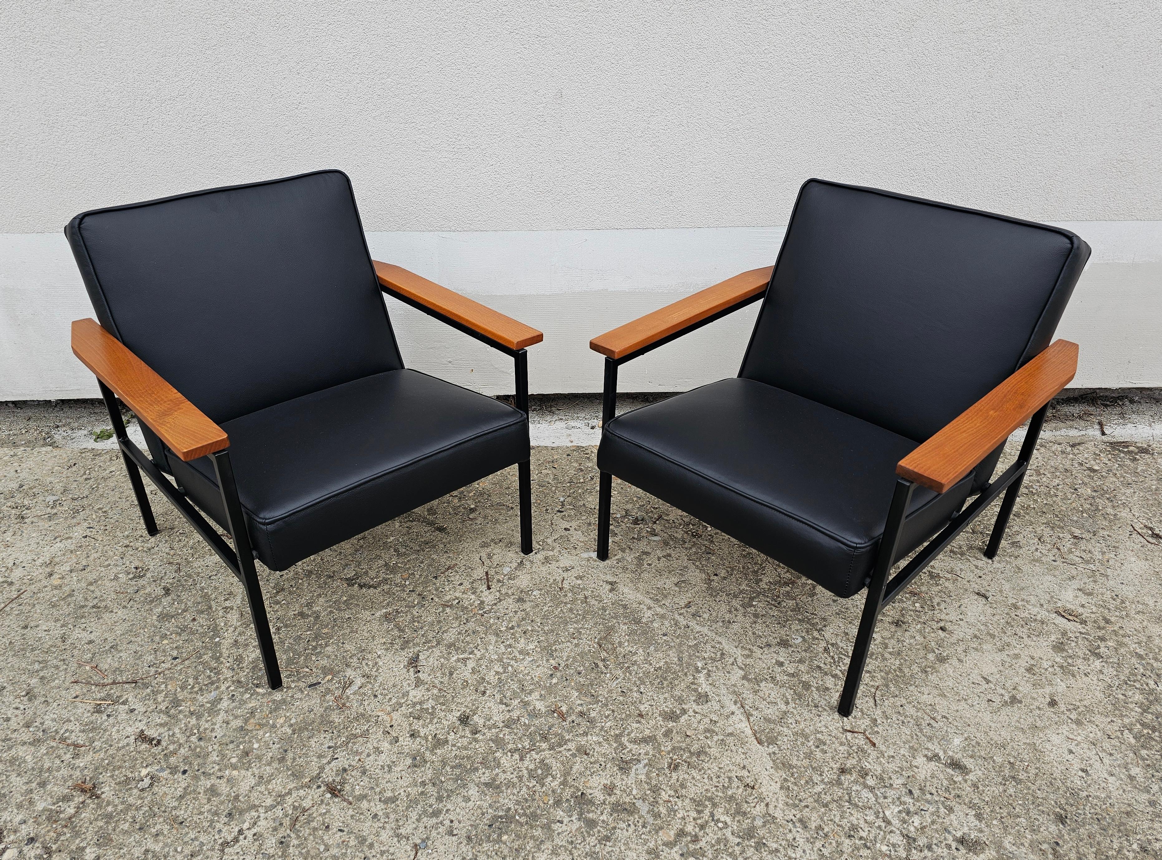 In this listing you will find a pair of sleek Mid Century Modern Armchairs manufactured by Stol Kamnik and designed by its creative director Branko Ursic. The chairs were originally upholstered in black vinyl but due to damages they suffered over