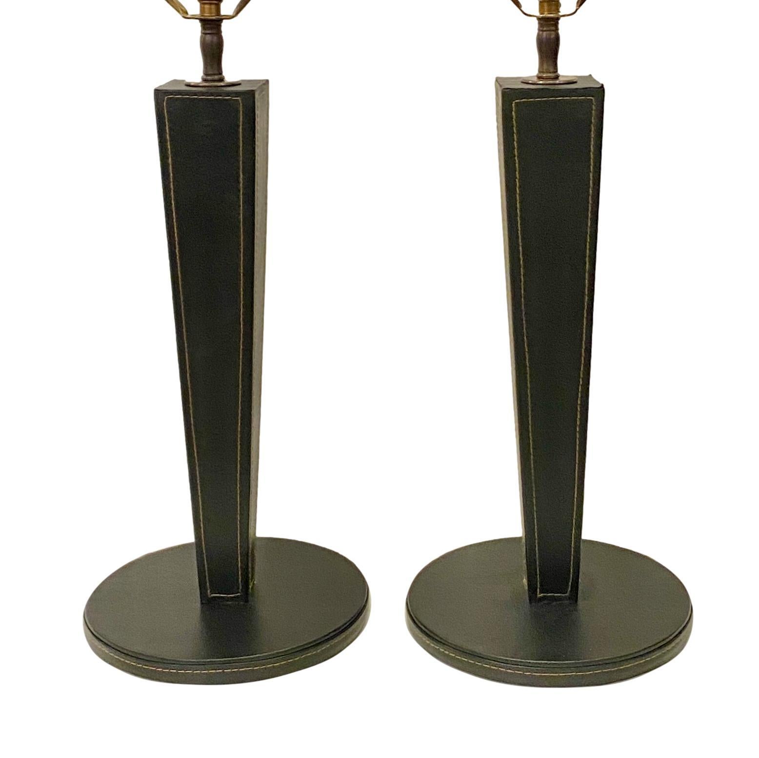 Pair of circa 1950's French leather bound table lamps.

Measurements:
Height of body: 15