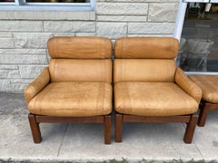 Pair of Mid-Century Leather Lounge Chairs with Ottoman