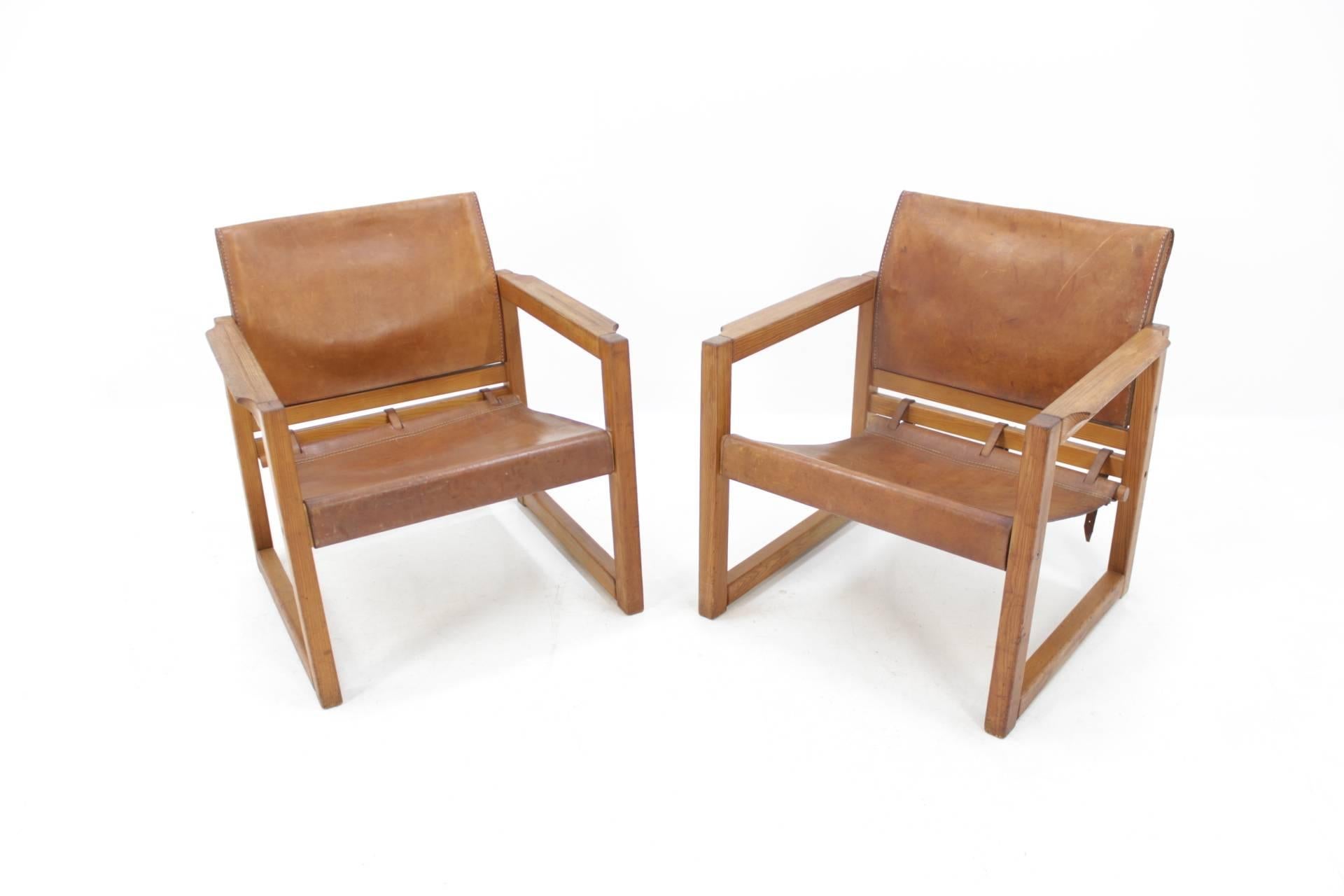 A pair of leather “Safari” chairs designed by the Swedish designer Karin Mobring and produced in the 1970s.