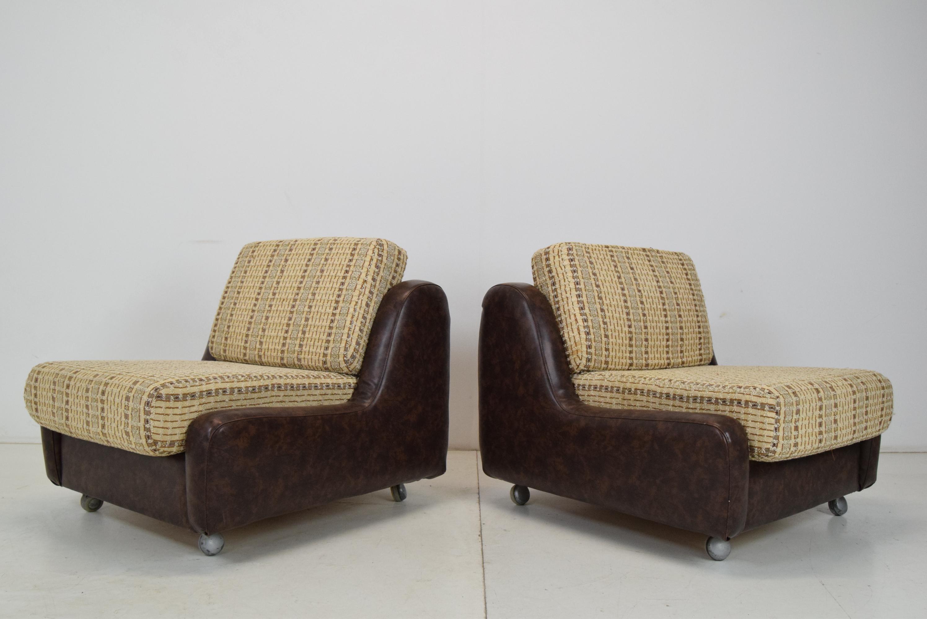 Mid-Century Modern Pair of Mid-century Leatherette Armchairs on the wheels, 1970's.  For Sale