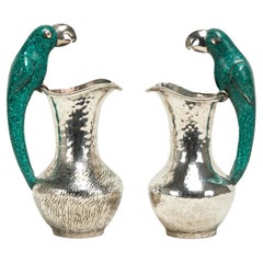 Pair of Mid Century Los Castillos Silver on Copper Pitchers with Parrot Handles