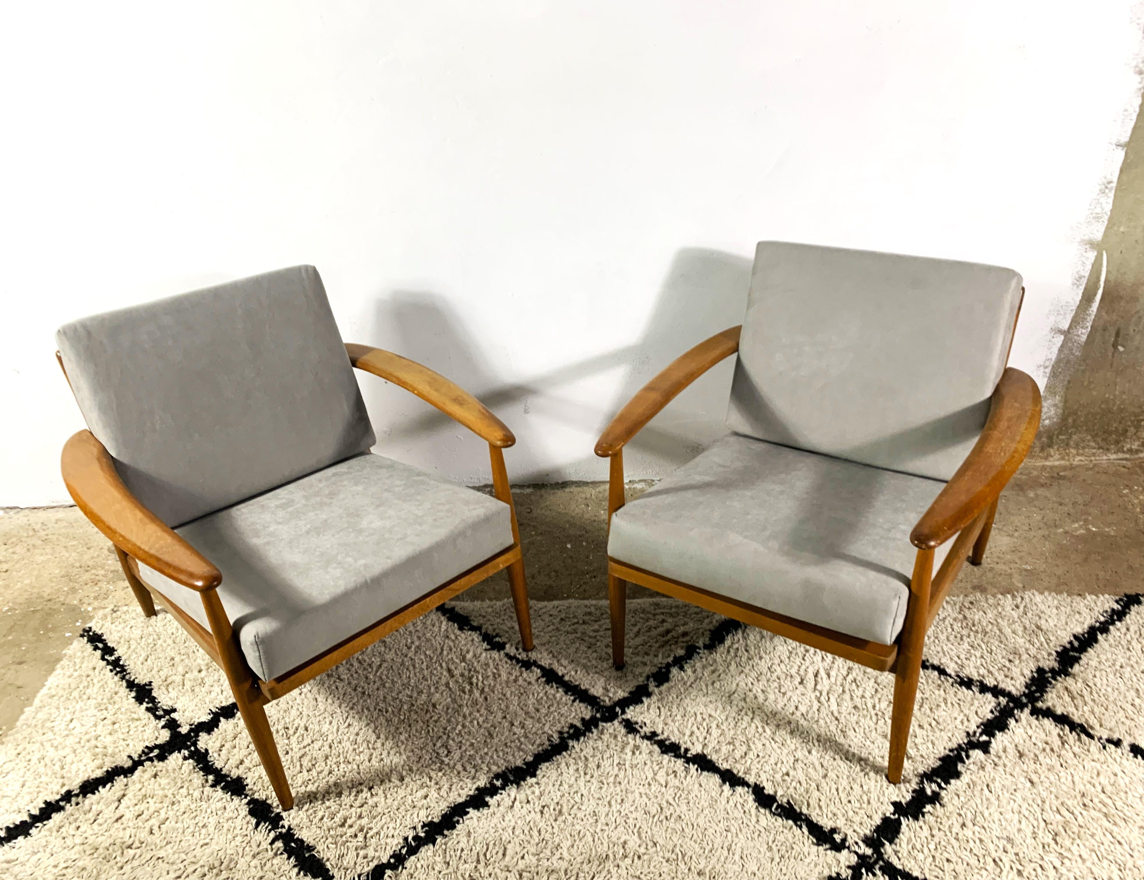 A pair of Scandinavian lounge chairs from the 1960s. The construction is made of varnished beech wood, in the style of Grete Jalk. The seat and backrest are cushions with new filling and new upholstery, removable for washing. Comfortable and stylish!