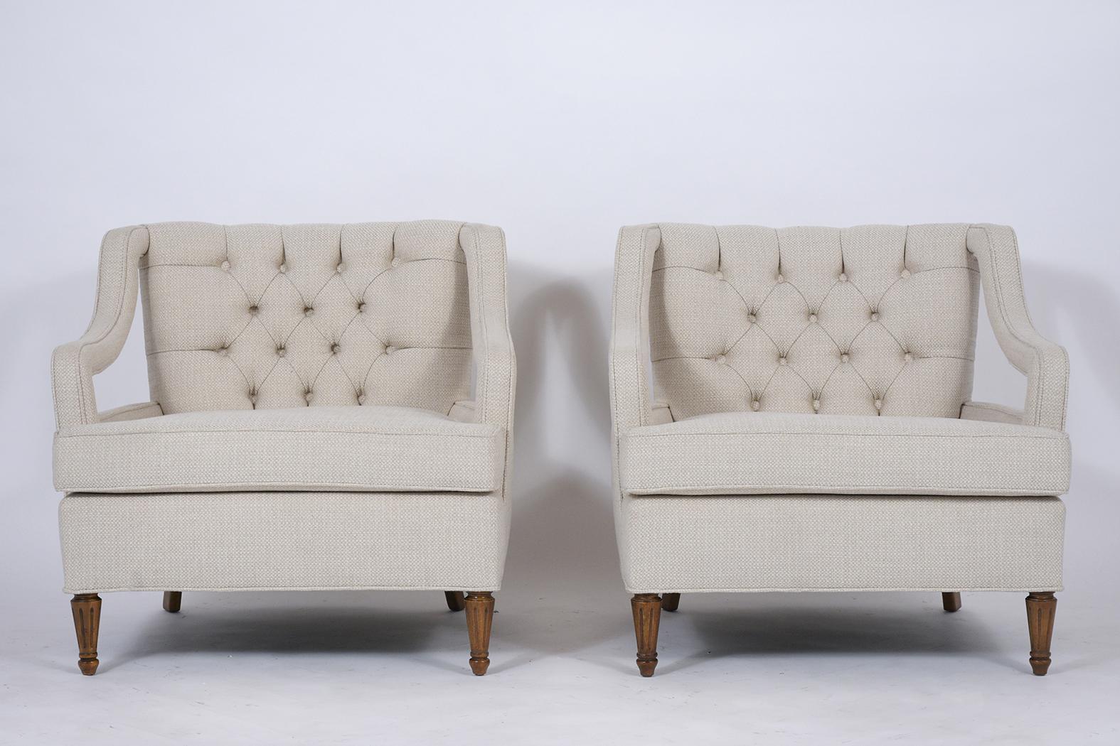This pair of 1960s midcentury lounge chairs have been completely restored and feature a stylish curved back and open arm design. These club chairs have been professionally upholstered in beige color fabric tufted design with single piping trim